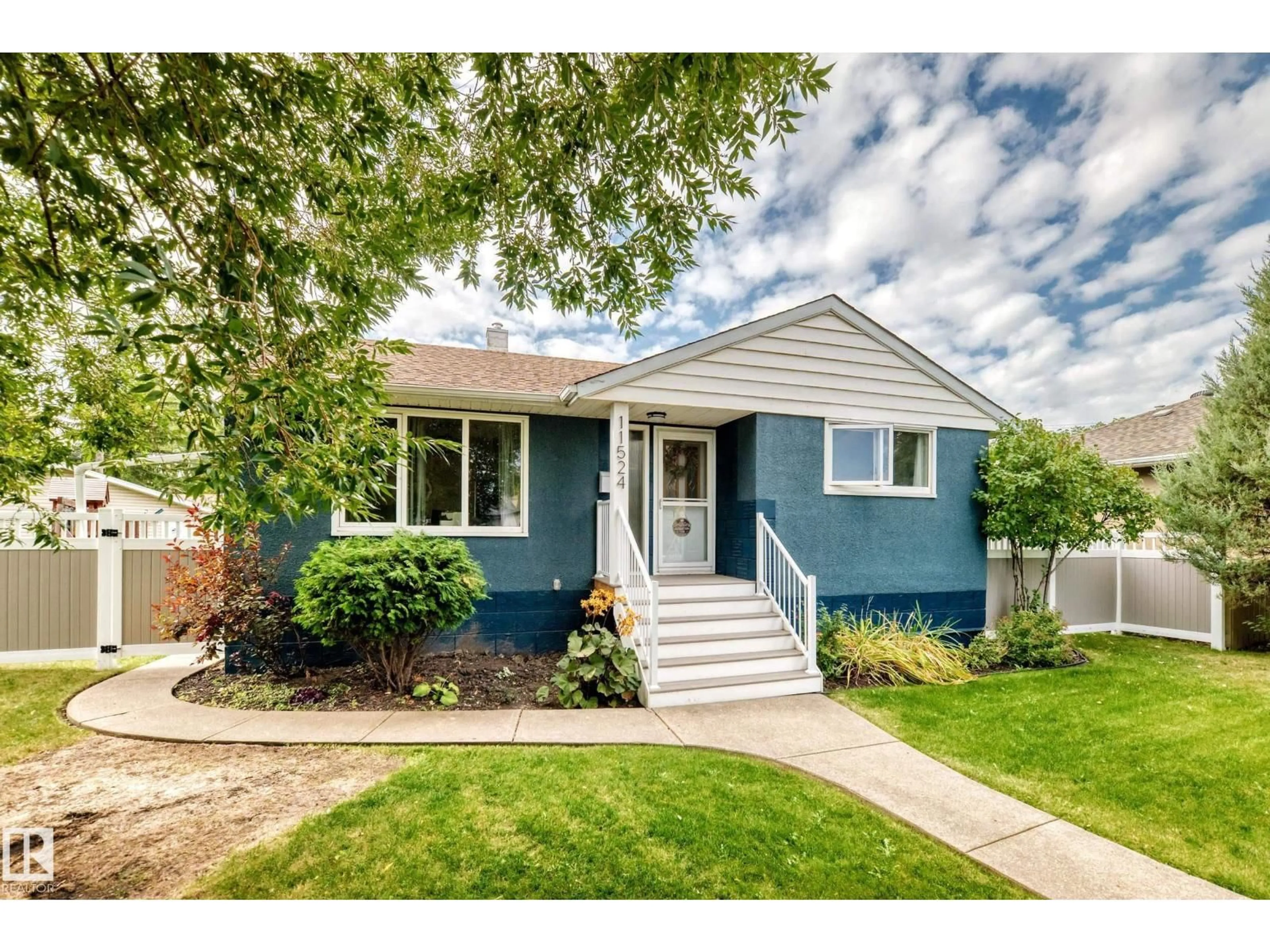 Home with vinyl exterior material, street for 11524 133 ST, Edmonton Alberta T5M1H4