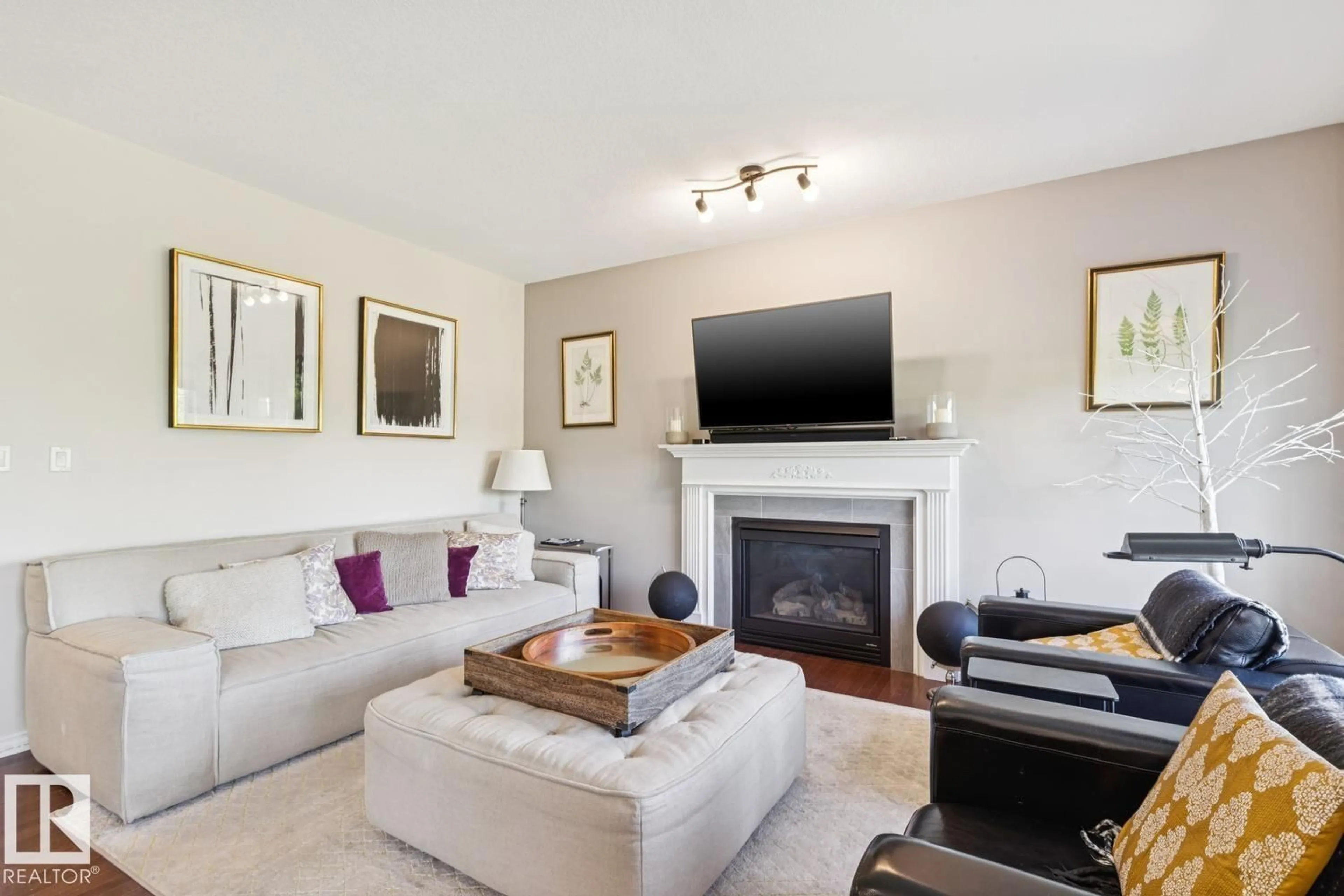 Living room with furniture, wood/laminate floor for 20616 57 AV, Edmonton Alberta T6M0B6