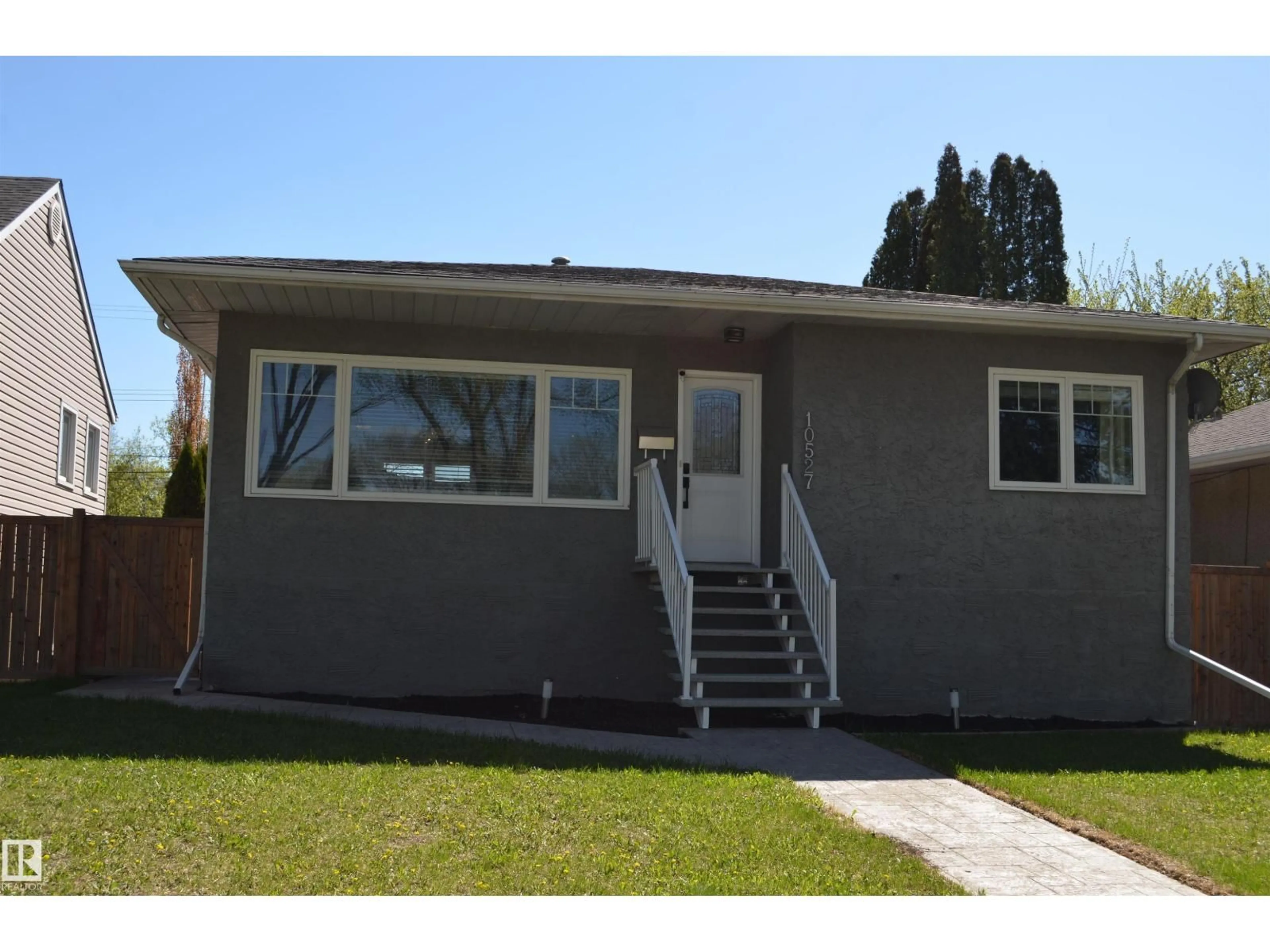 Home with vinyl exterior material, street for NW - 10527 81 ST, Edmonton Alberta T6A3L3