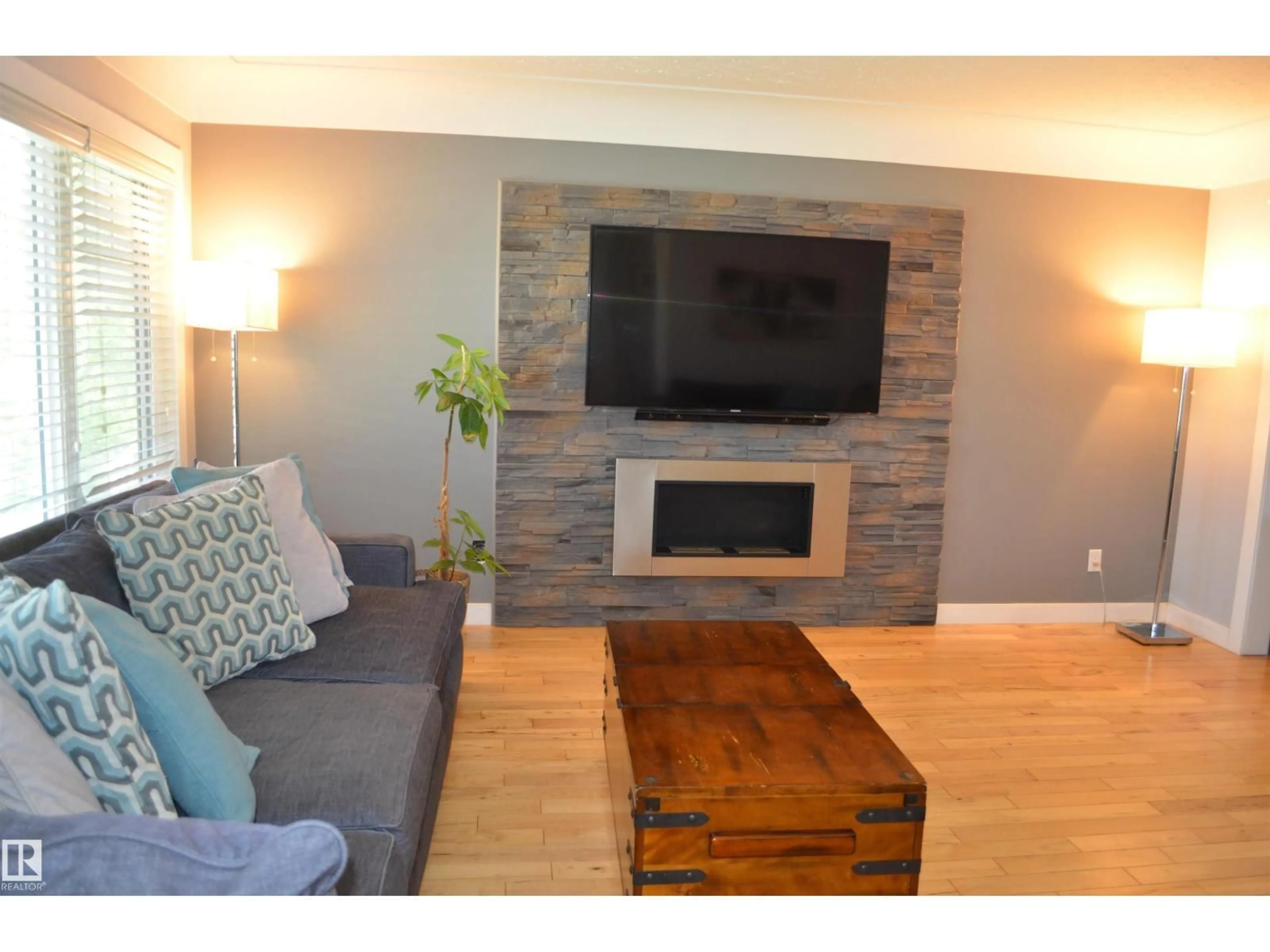 Living room with furniture, wood/laminate floor for NW - 10527 81 ST, Edmonton Alberta T6A3L3