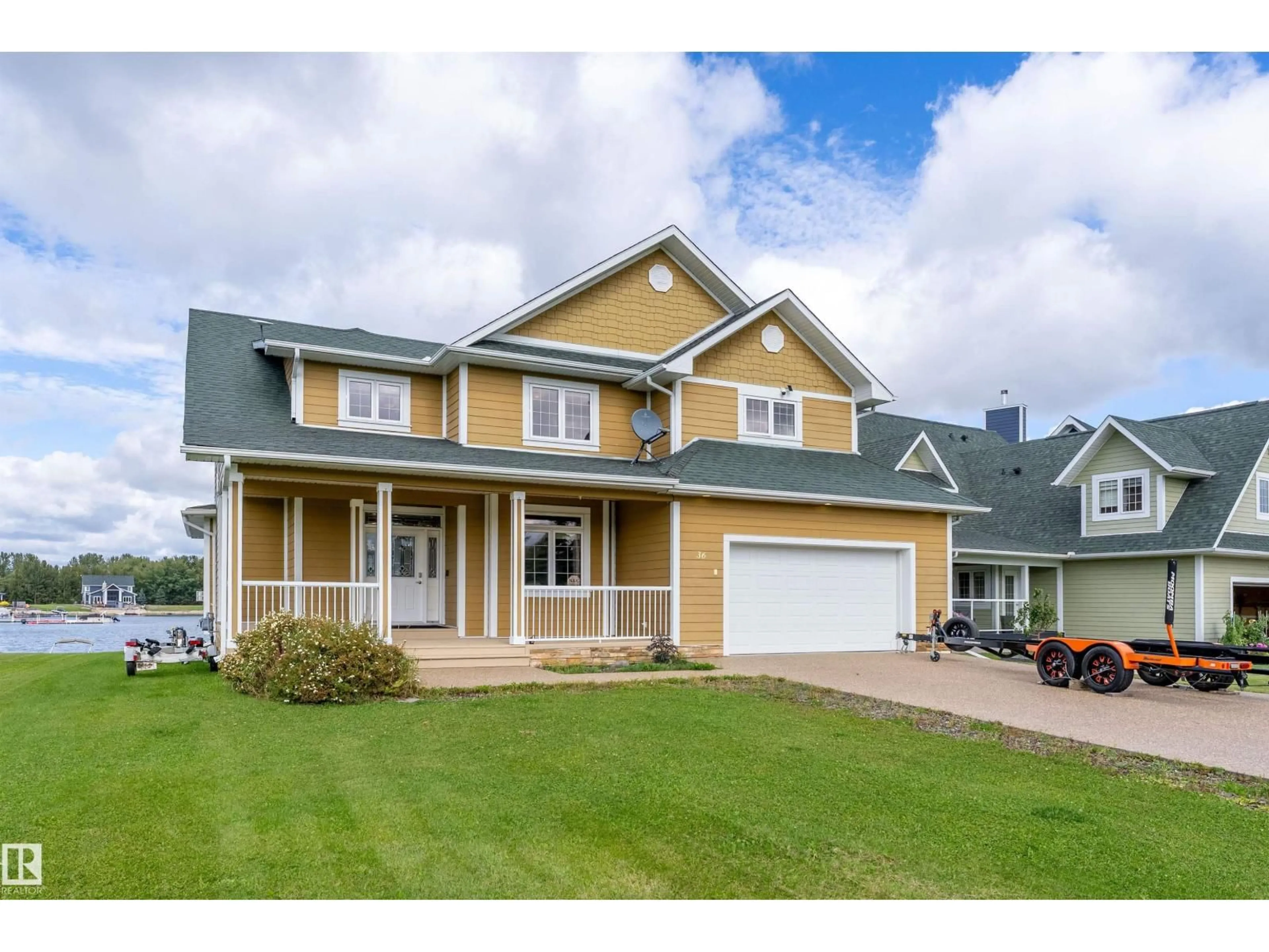 Home with vinyl exterior material, street for 36 SUNSET HARBOUR, Rural Wetaskiwin County Alberta T0C2V0