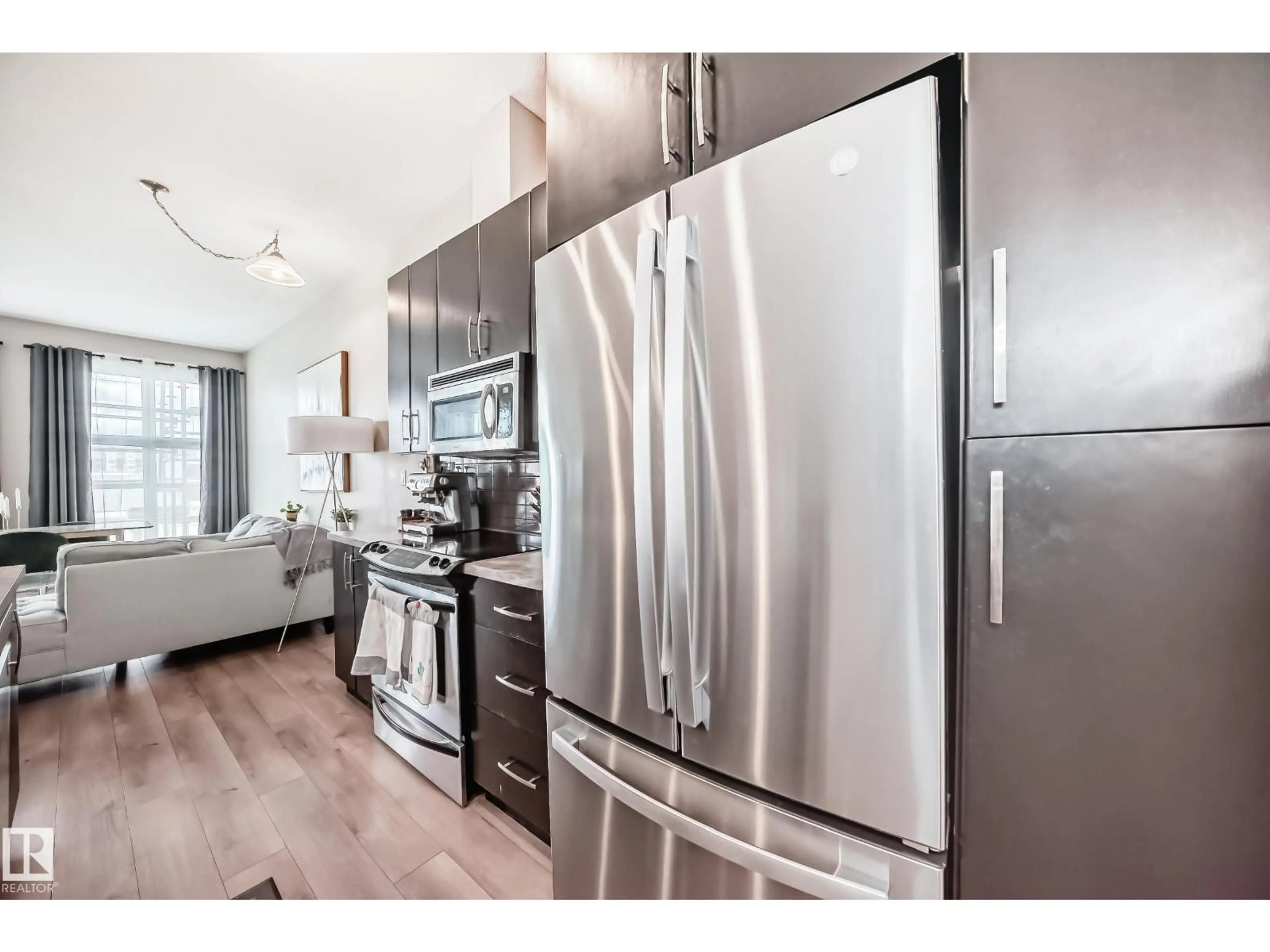 Open concept kitchen, wood/laminate floor for 216 - 10531 117 ST NW, Edmonton Alberta T5H0A8