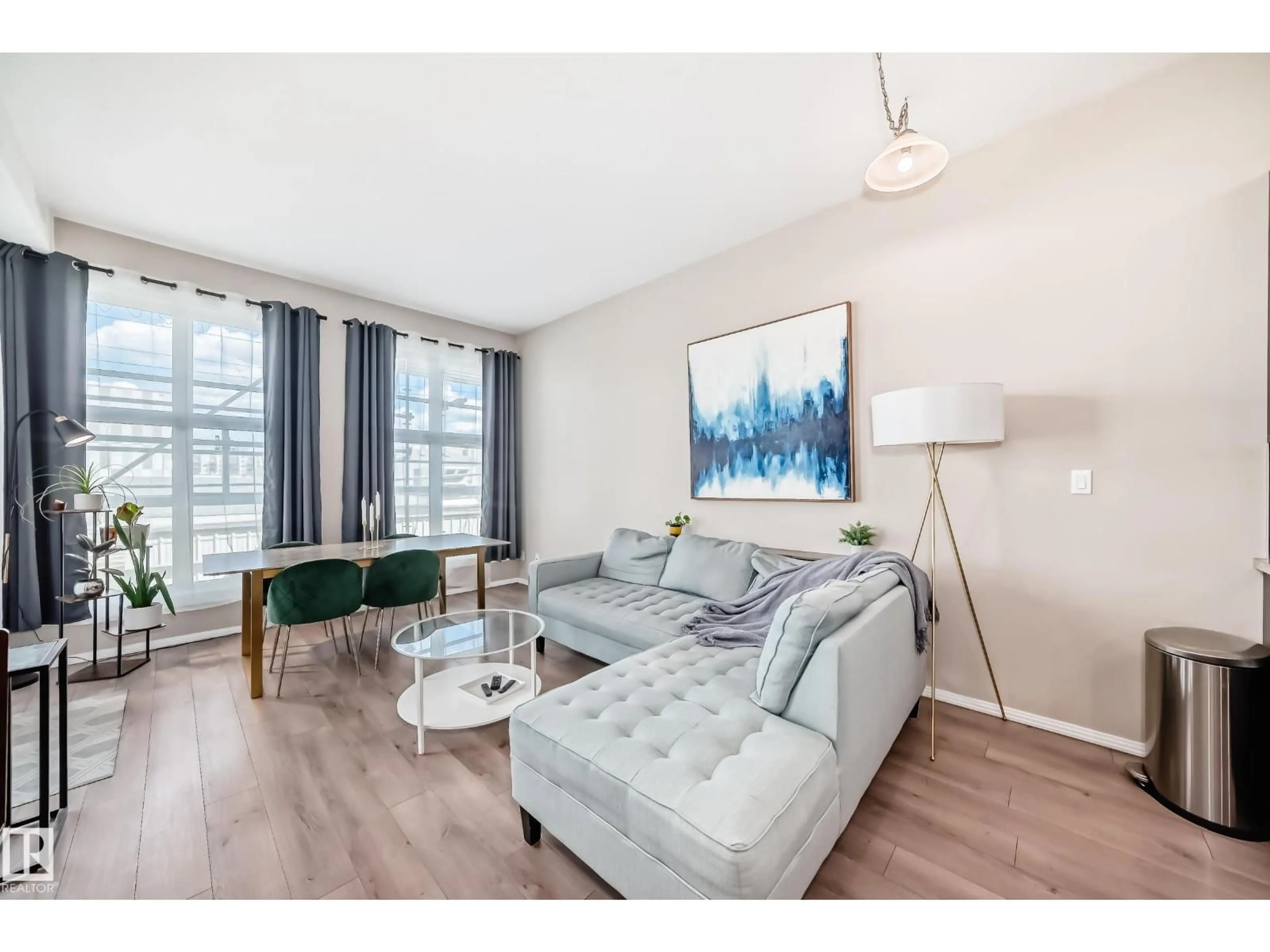 Living room with furniture, wood/laminate floor for 216 - 10531 117 ST NW, Edmonton Alberta T5H0A8