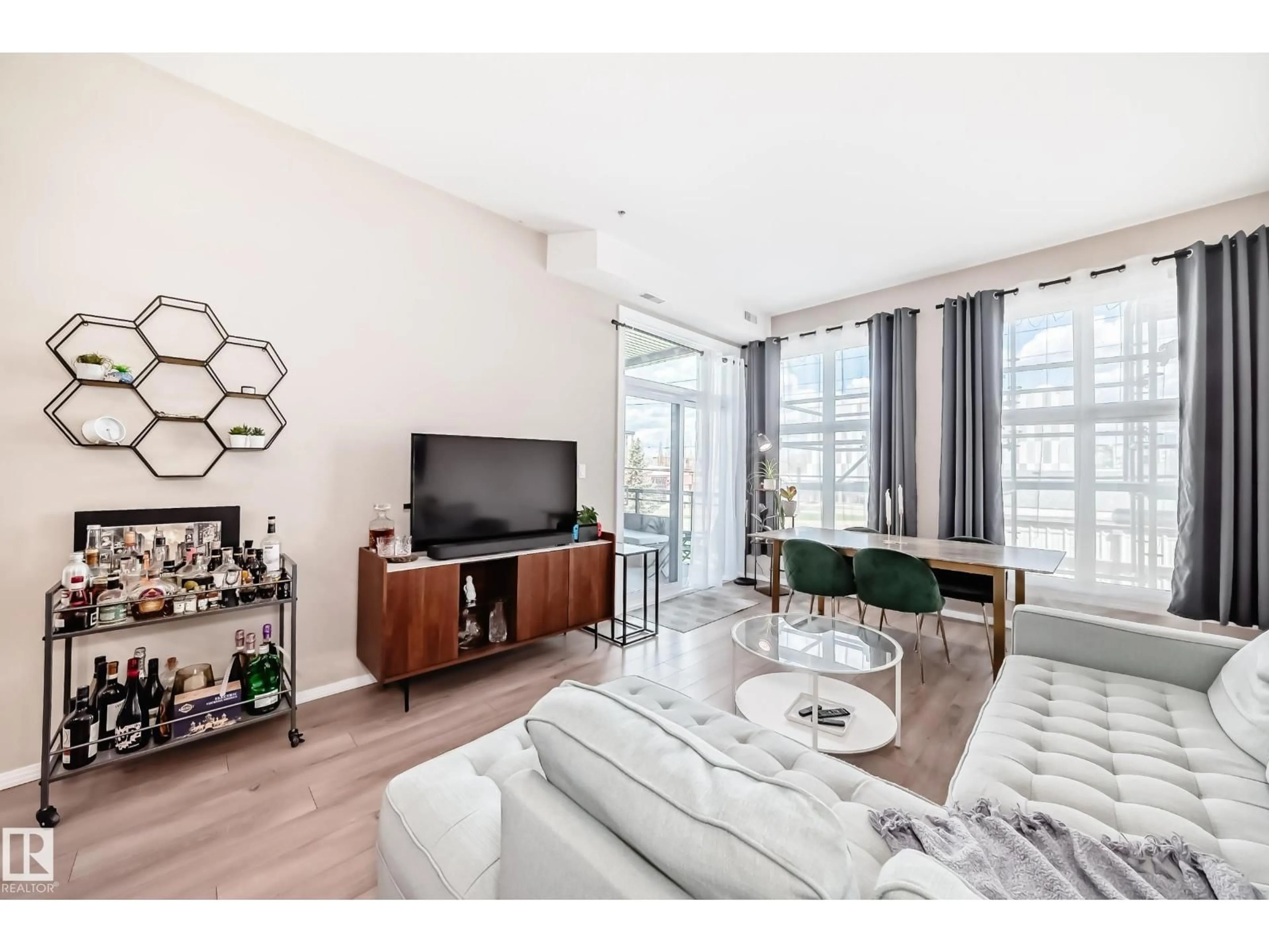 Living room with furniture, wood/laminate floor for 216 - 10531 117 ST NW, Edmonton Alberta T5H0A8