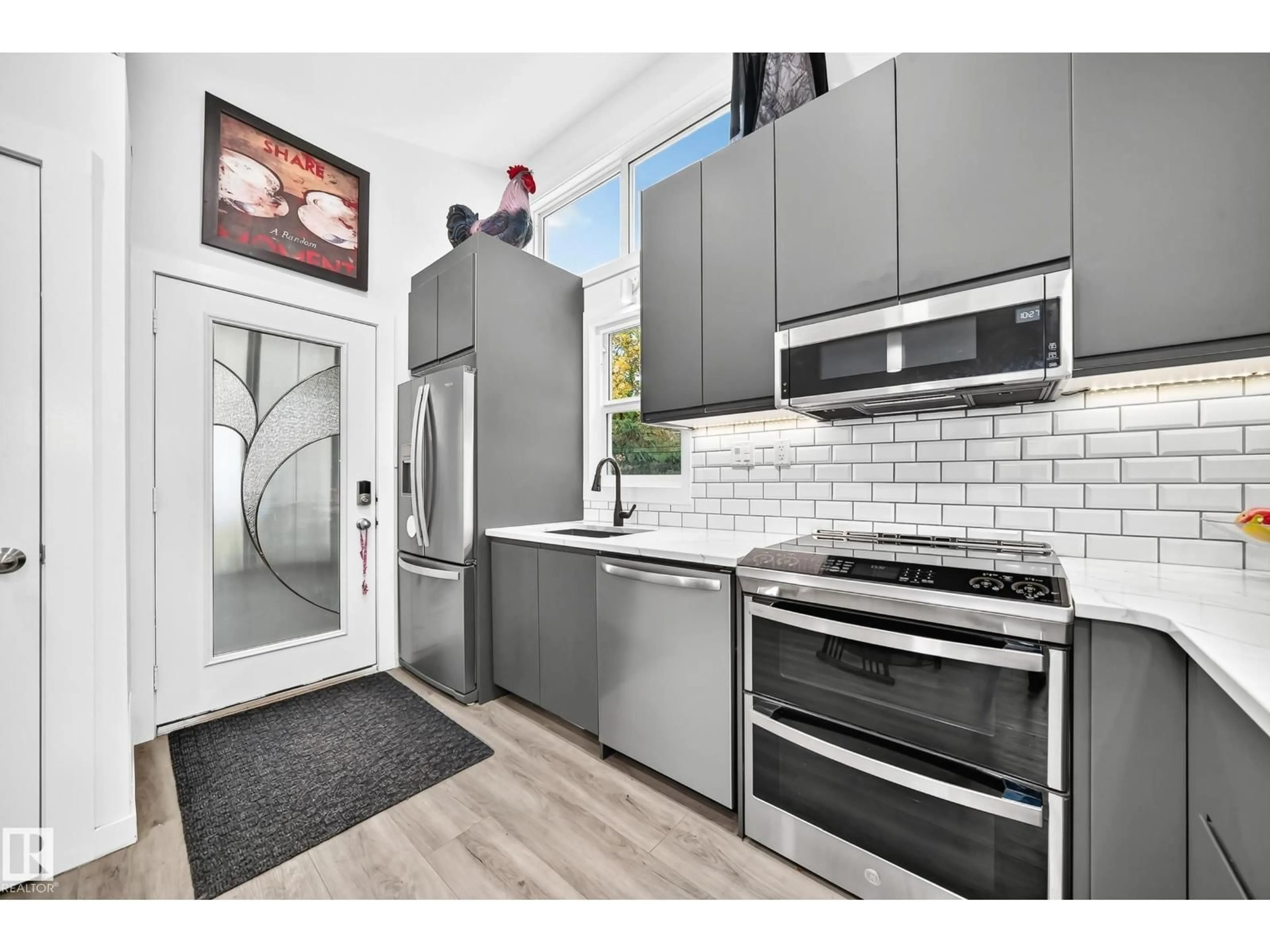 Open concept kitchen, ceramic/tile floor for 12045 64 ST, Edmonton Alberta T5W4J5