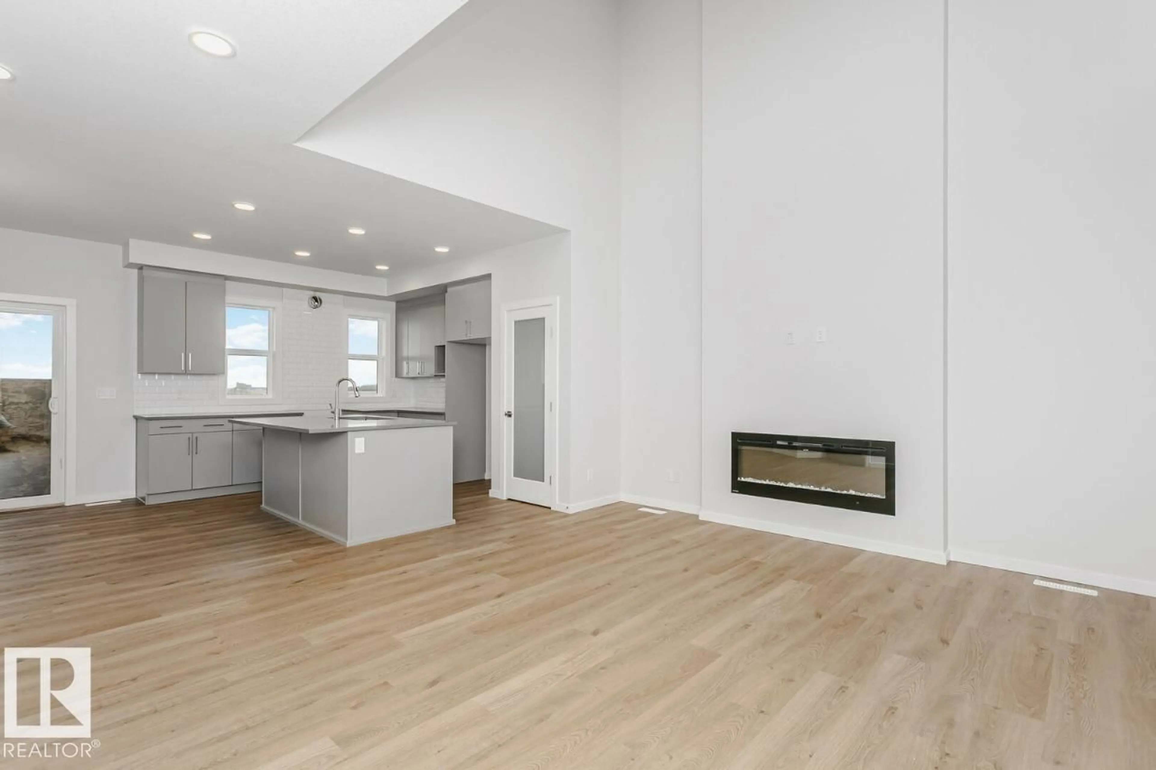 Open concept kitchen, wood/laminate floor for 264 LODGE POLE PL, Leduc Alberta T4X0L1
