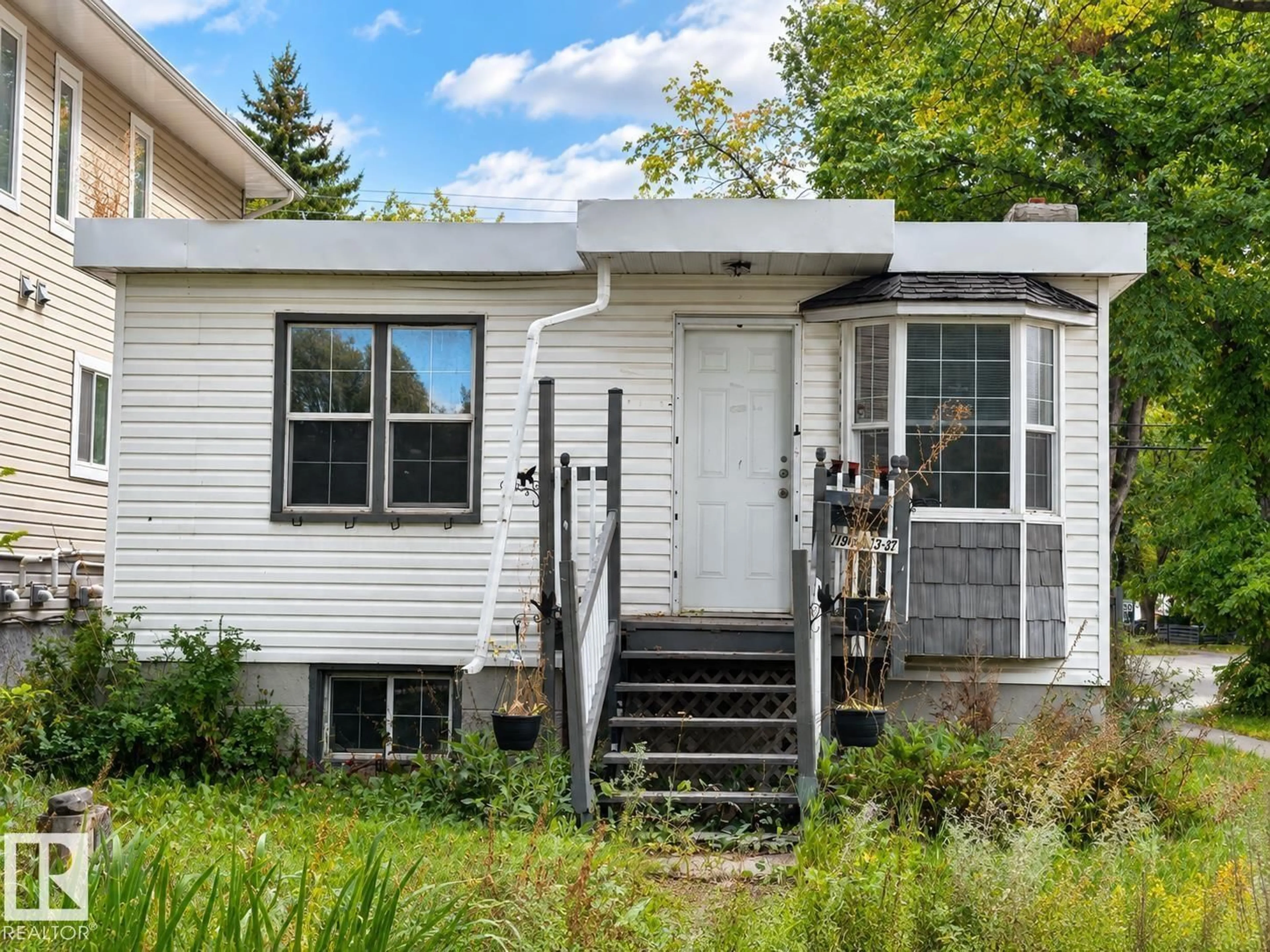 Home with vinyl exterior material, street for NW - 11901 63 ST, Edmonton Alberta T5W4G2