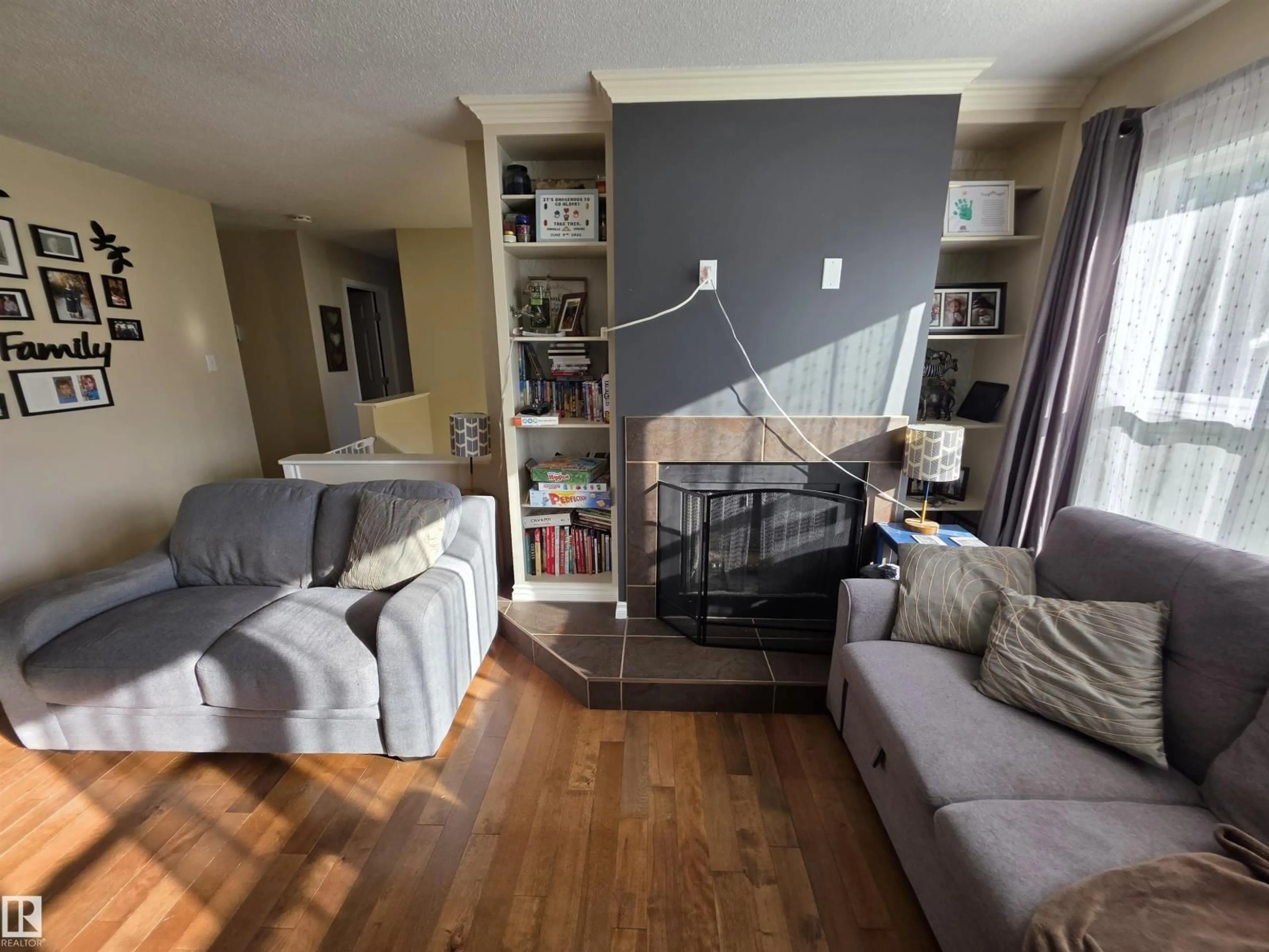 Living room with furniture, wood/laminate floor for 4804 55 AV, Drayton Valley Alberta T7A1B5