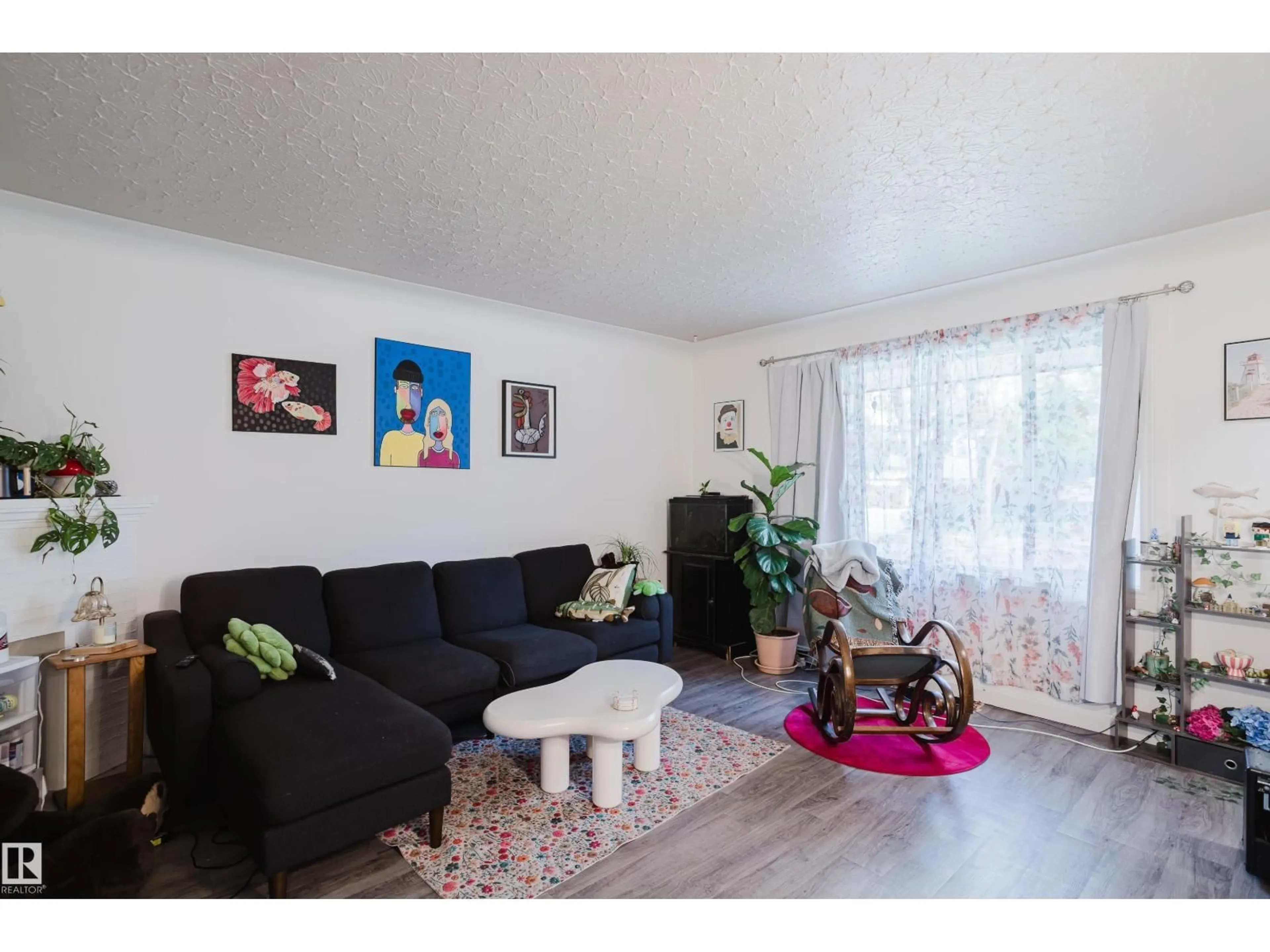 Living room with furniture, wood/laminate floor for 11134 116 ST, Edmonton Alberta T5G2V8