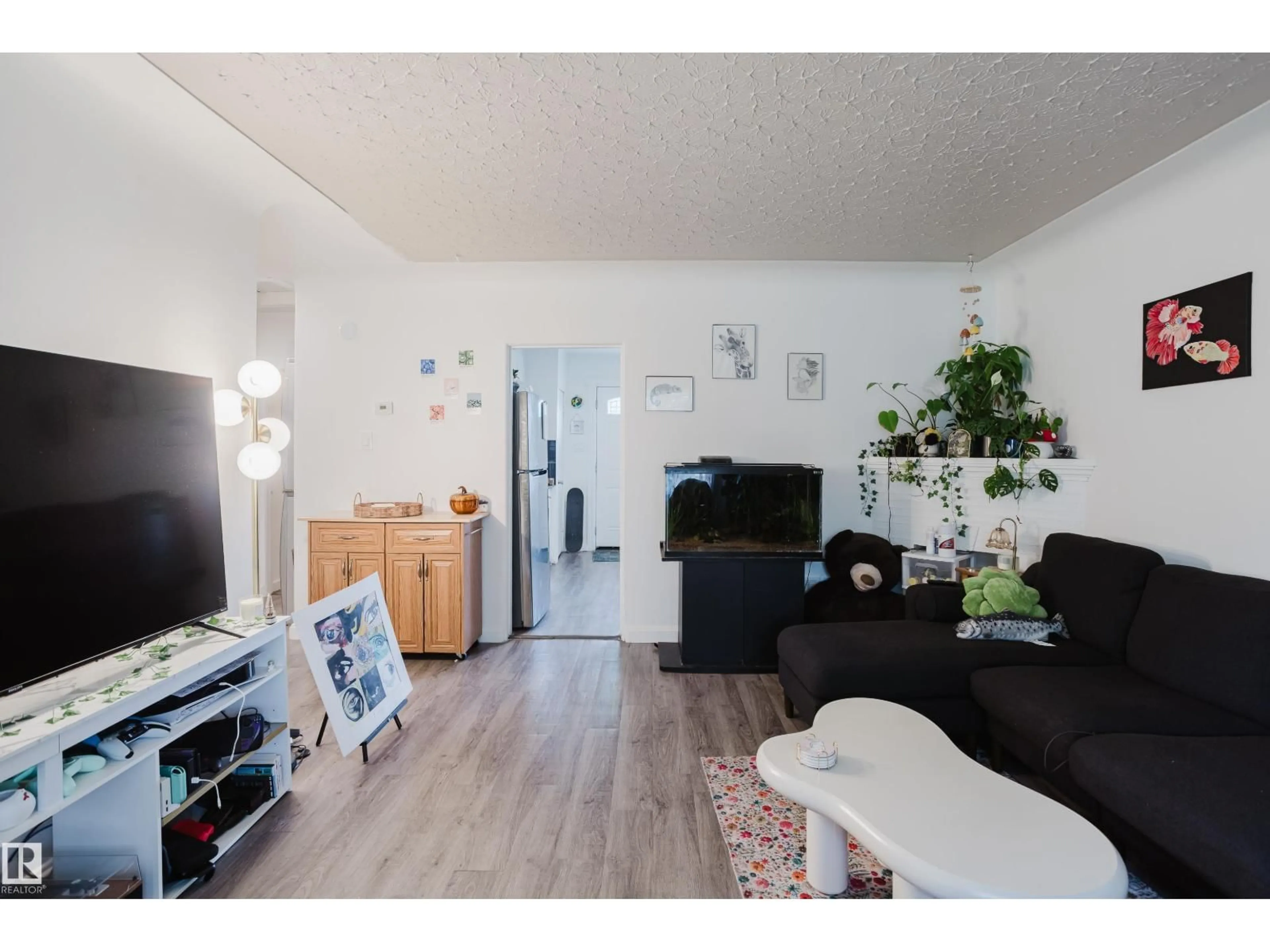 Living room with furniture, wood/laminate floor for 11134 116 ST, Edmonton Alberta T5G2V8