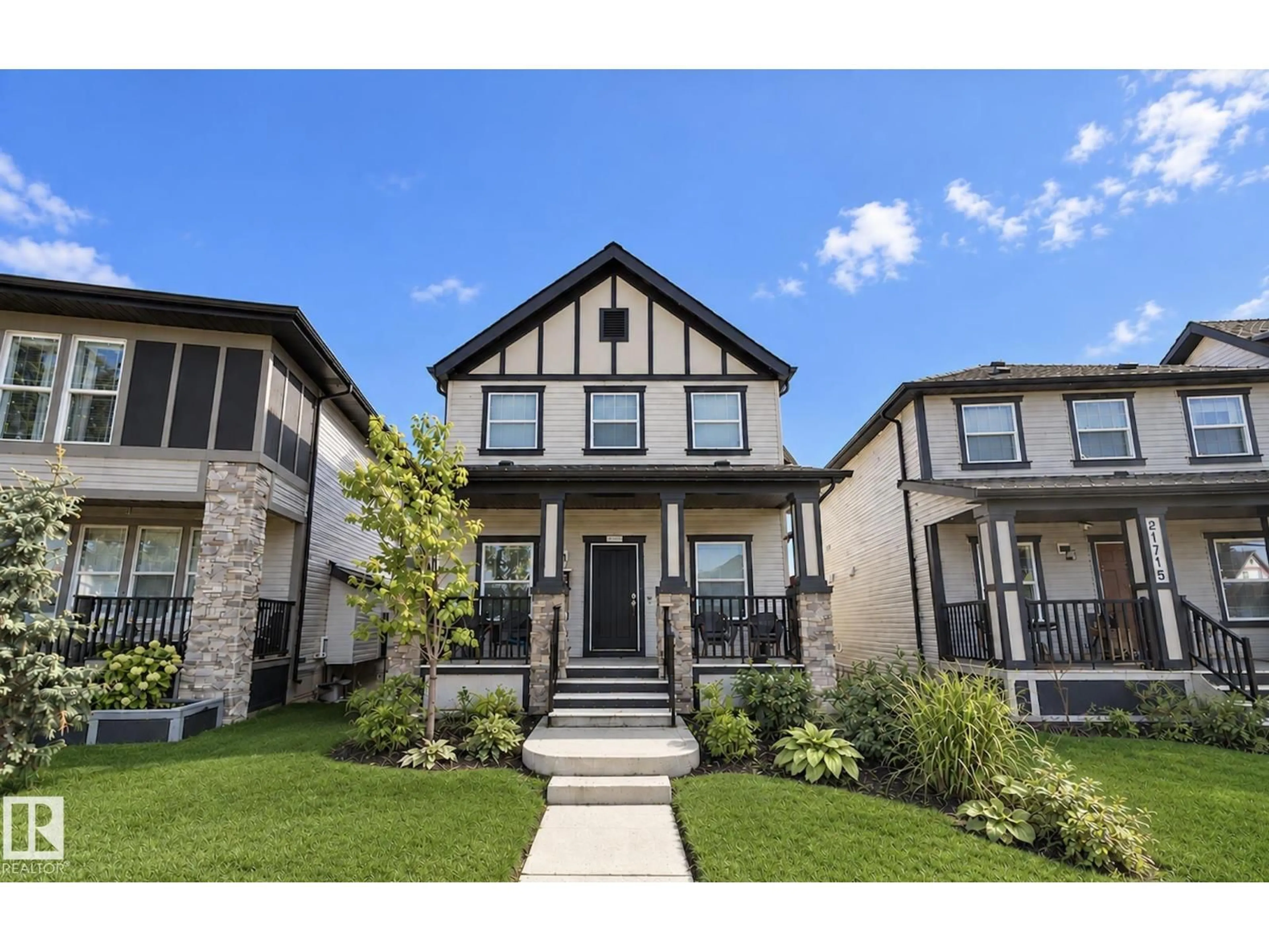 Home with brick exterior material, street for NW - 21711 99 AV, Edmonton Alberta T5T4T7