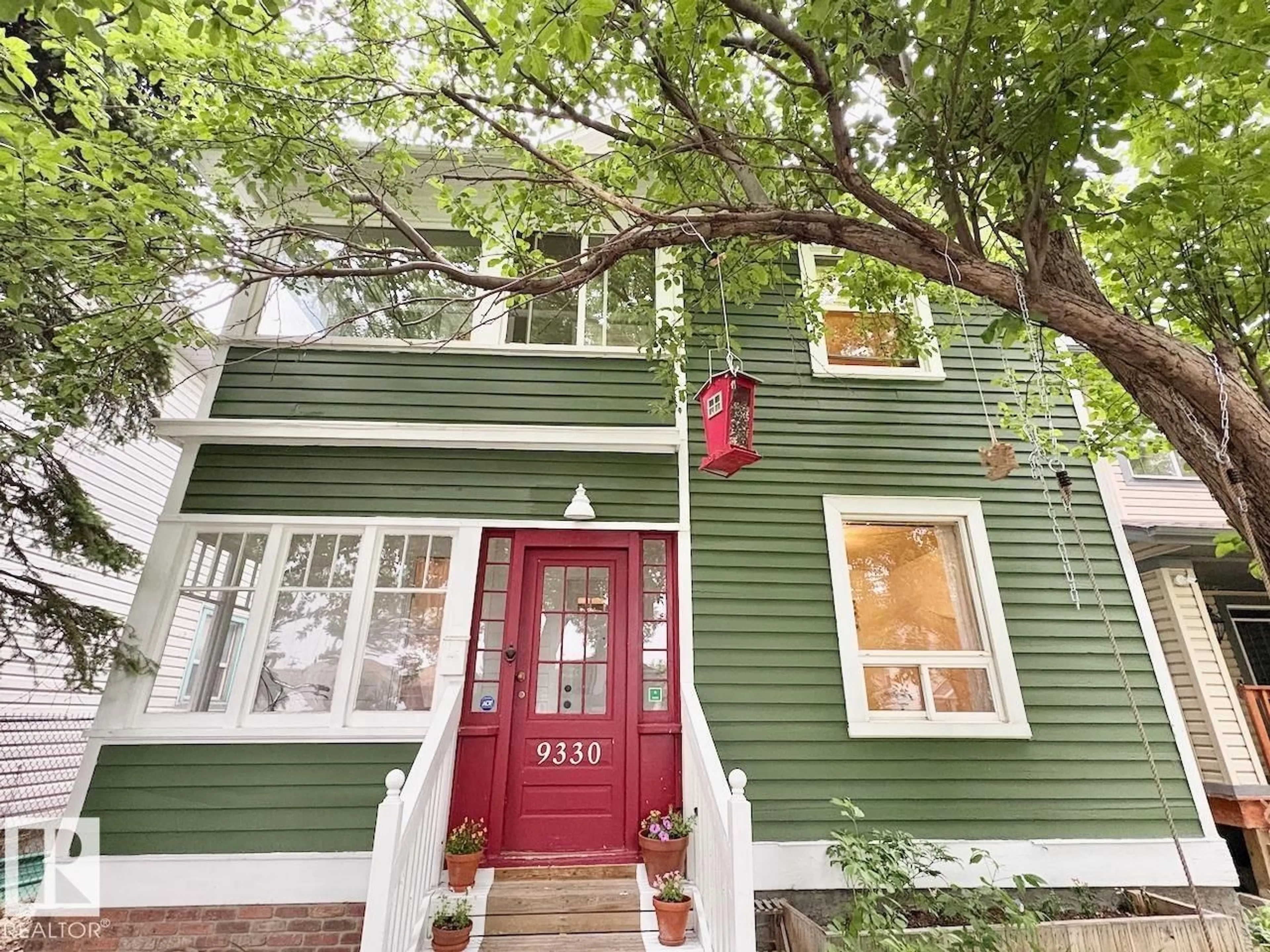 Home with vinyl exterior material, street for NW - 9330 107 AV, Edmonton Alberta T5H0T5