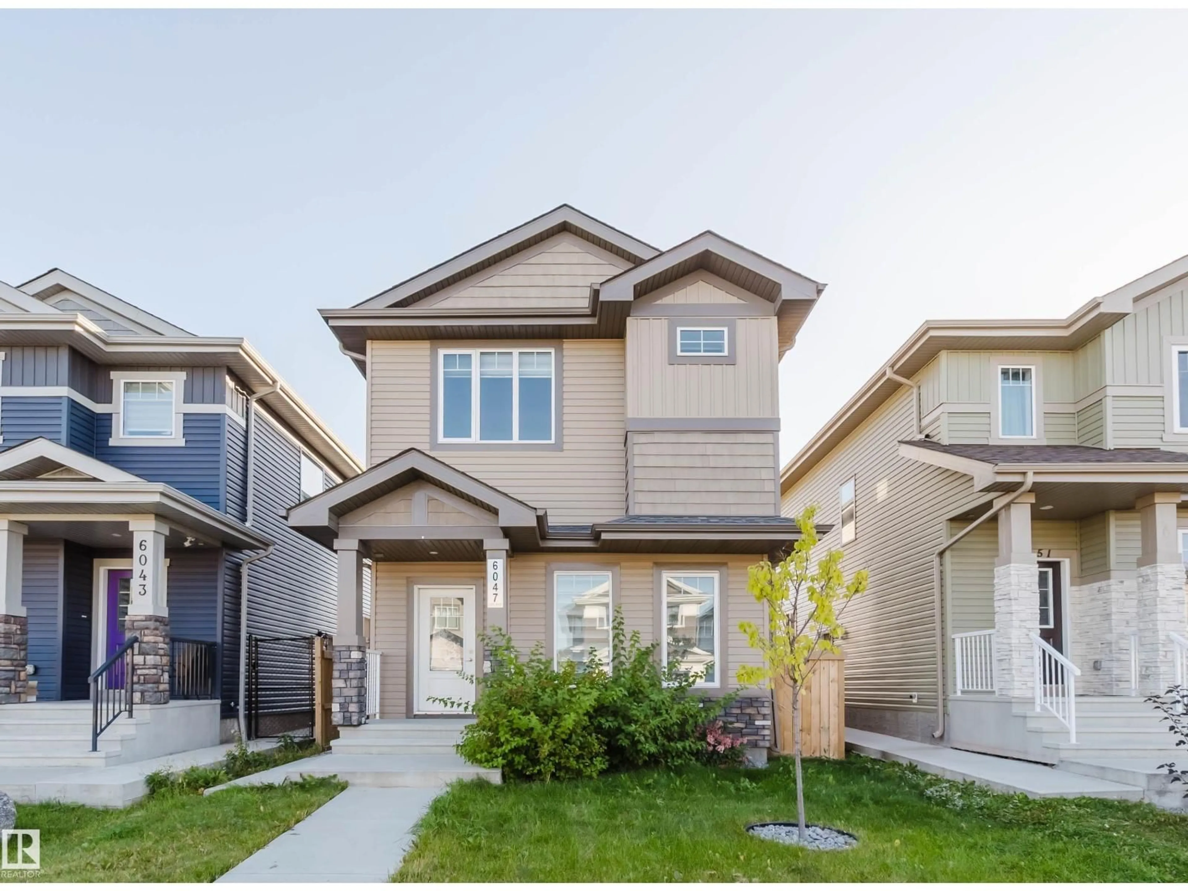 Home with vinyl exterior material, street for NW - 6047 180 AV, Edmonton Alberta T5Y3W9