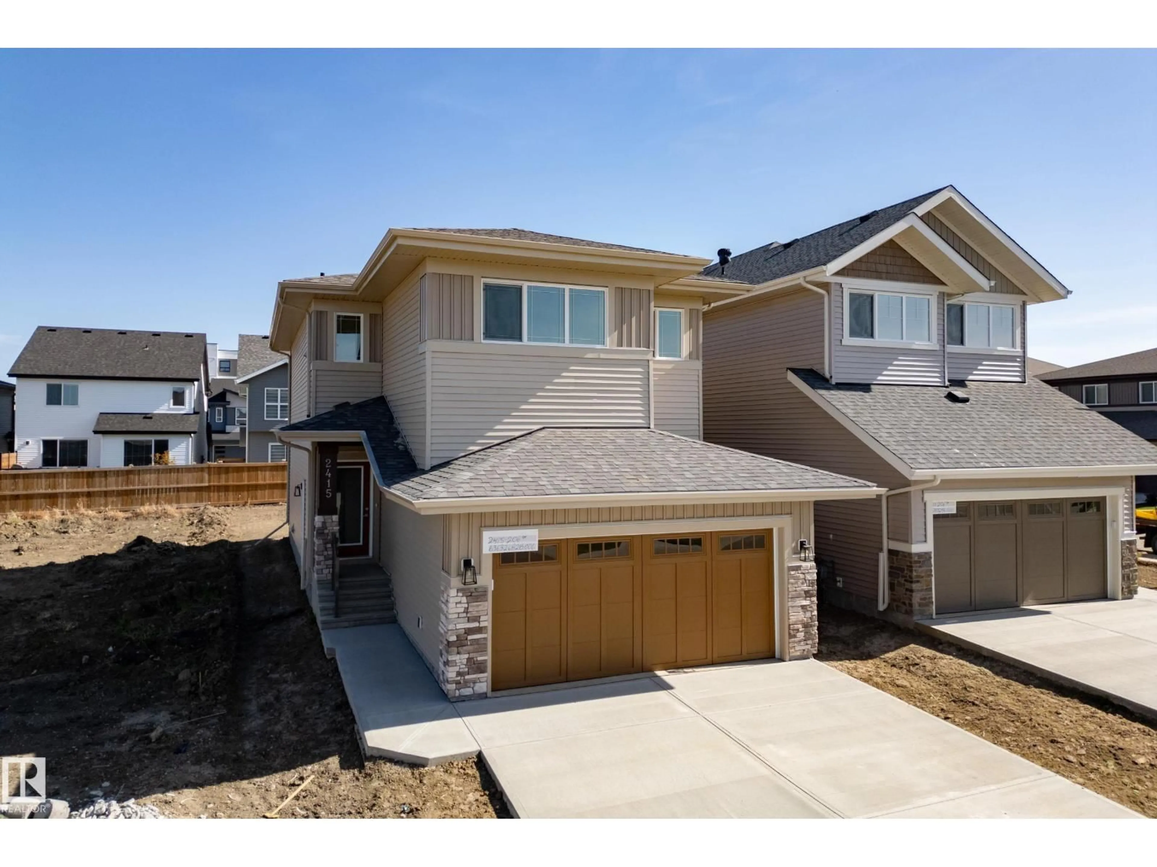 Home with vinyl exterior material, street for NW - 2415 206 ST, Edmonton Alberta T6M1N6