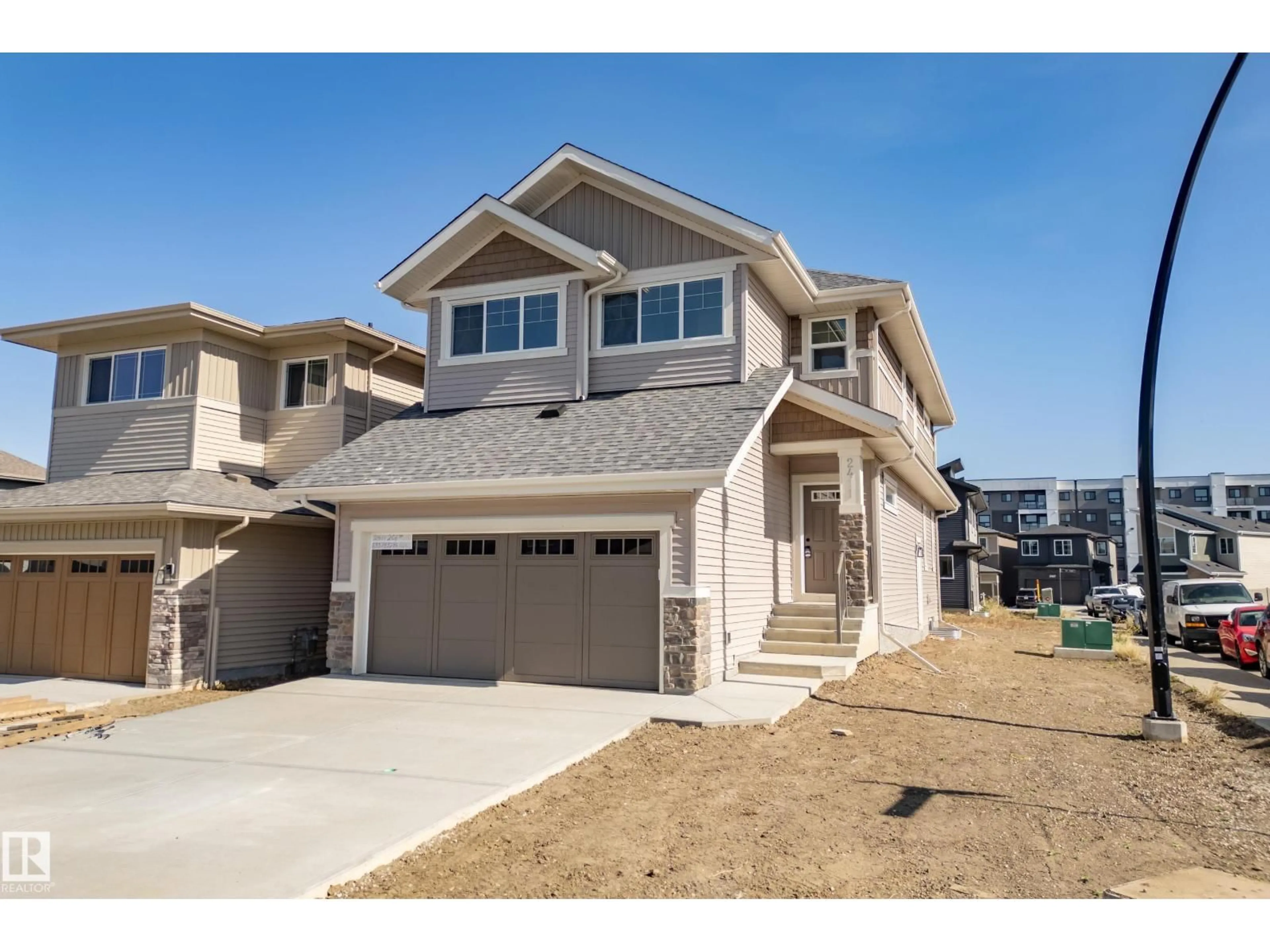 Home with vinyl exterior material, street for NW - 2411 206 ST, Edmonton Alberta T6M1N6