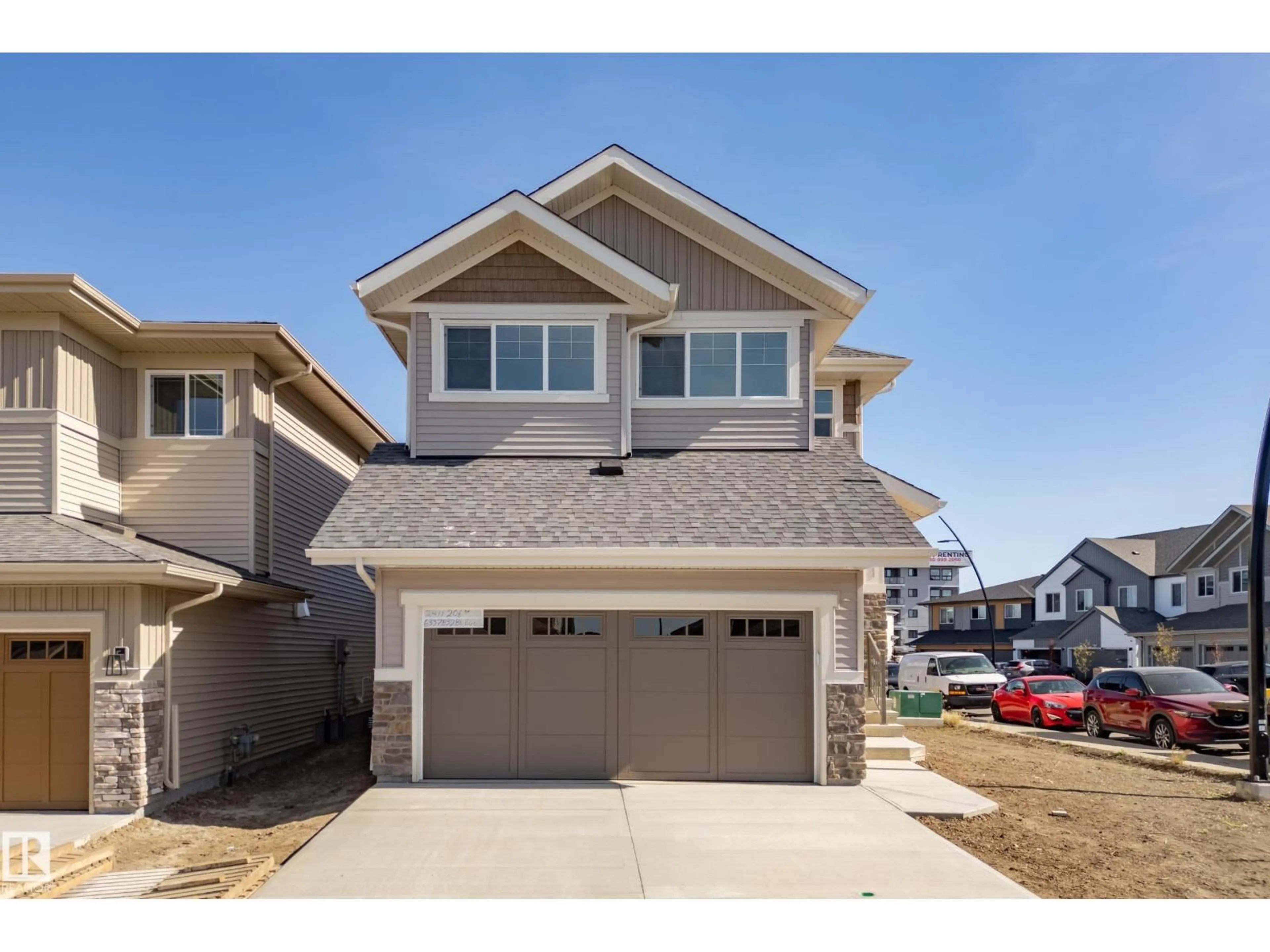 Home with vinyl exterior material, street for NW - 2411 206 ST, Edmonton Alberta T6M1N6