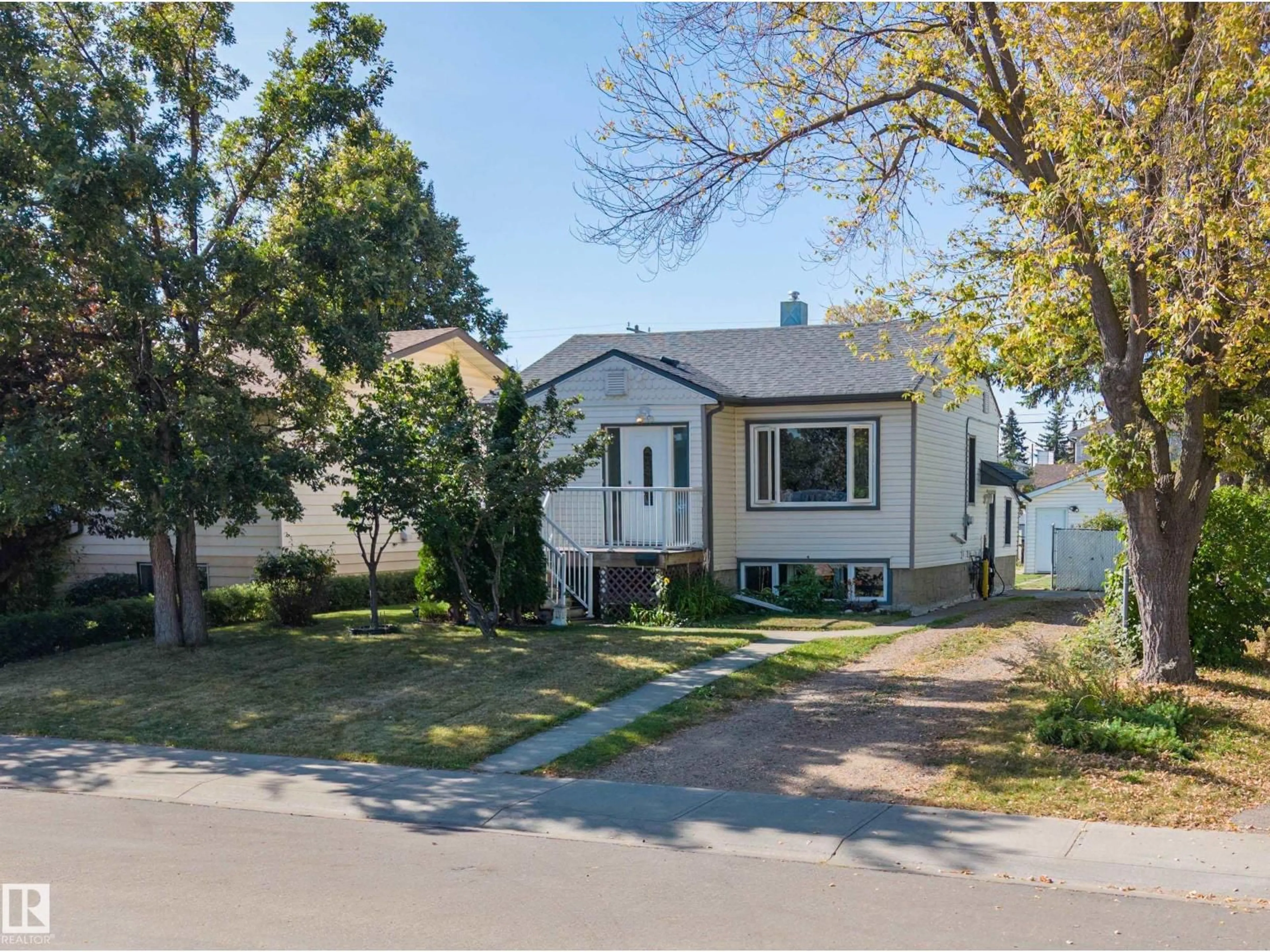 Home with vinyl exterior material, street for NW - 9912 154 ST, Edmonton Alberta T5P2G7
