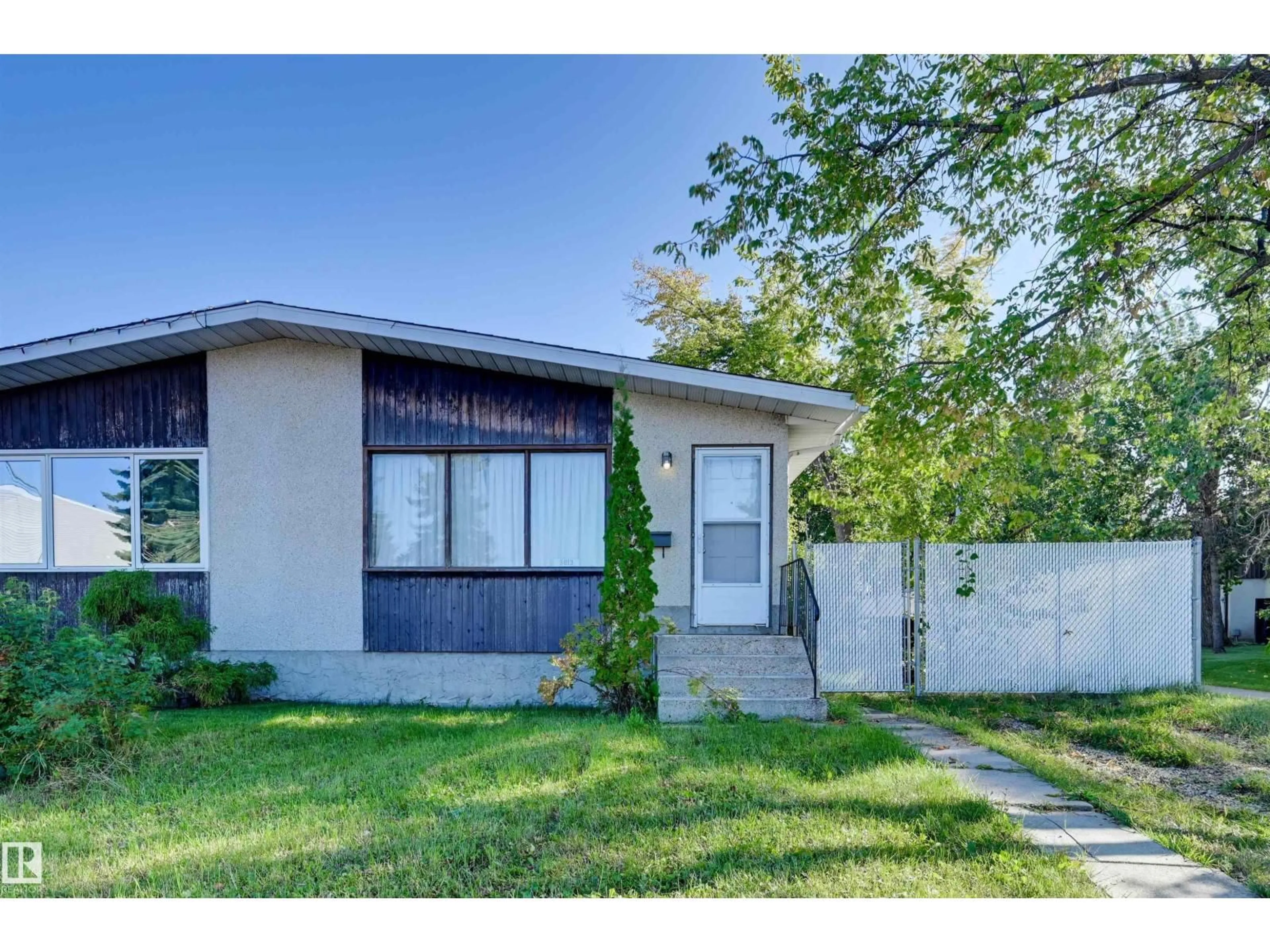 Home with vinyl exterior material, street for 3813 134 AV, Edmonton Alberta T5A3J7