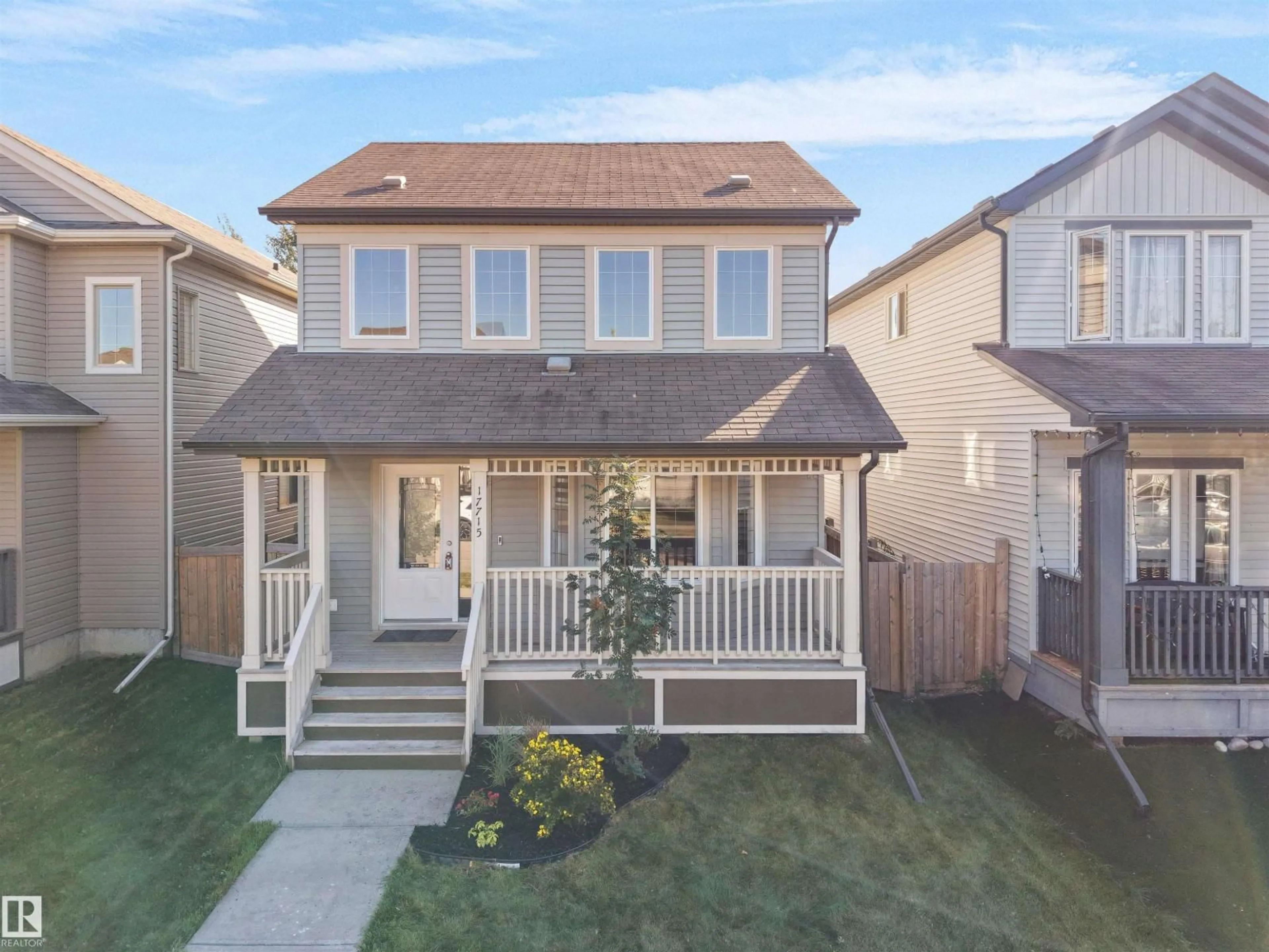 Home with vinyl exterior material, street for 17715 6 AV, Edmonton Alberta T6W2G6
