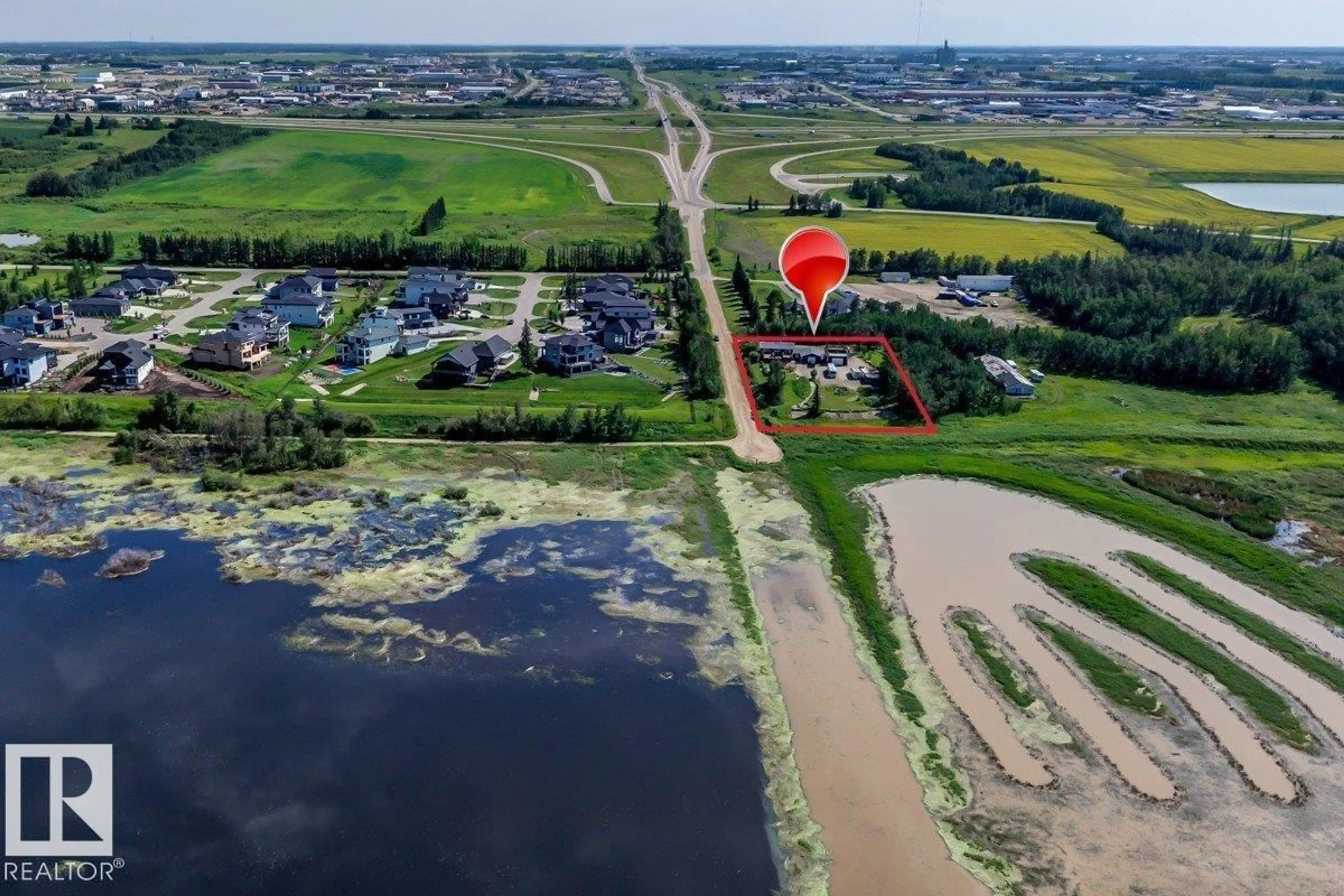 A pic from outside/outdoor area/front of a property/back of a property/a pic from drone, water/lake/river/ocean view for #2 - 53220 RGE ROAD 263, Rural Parkland County Alberta T7X4M1
