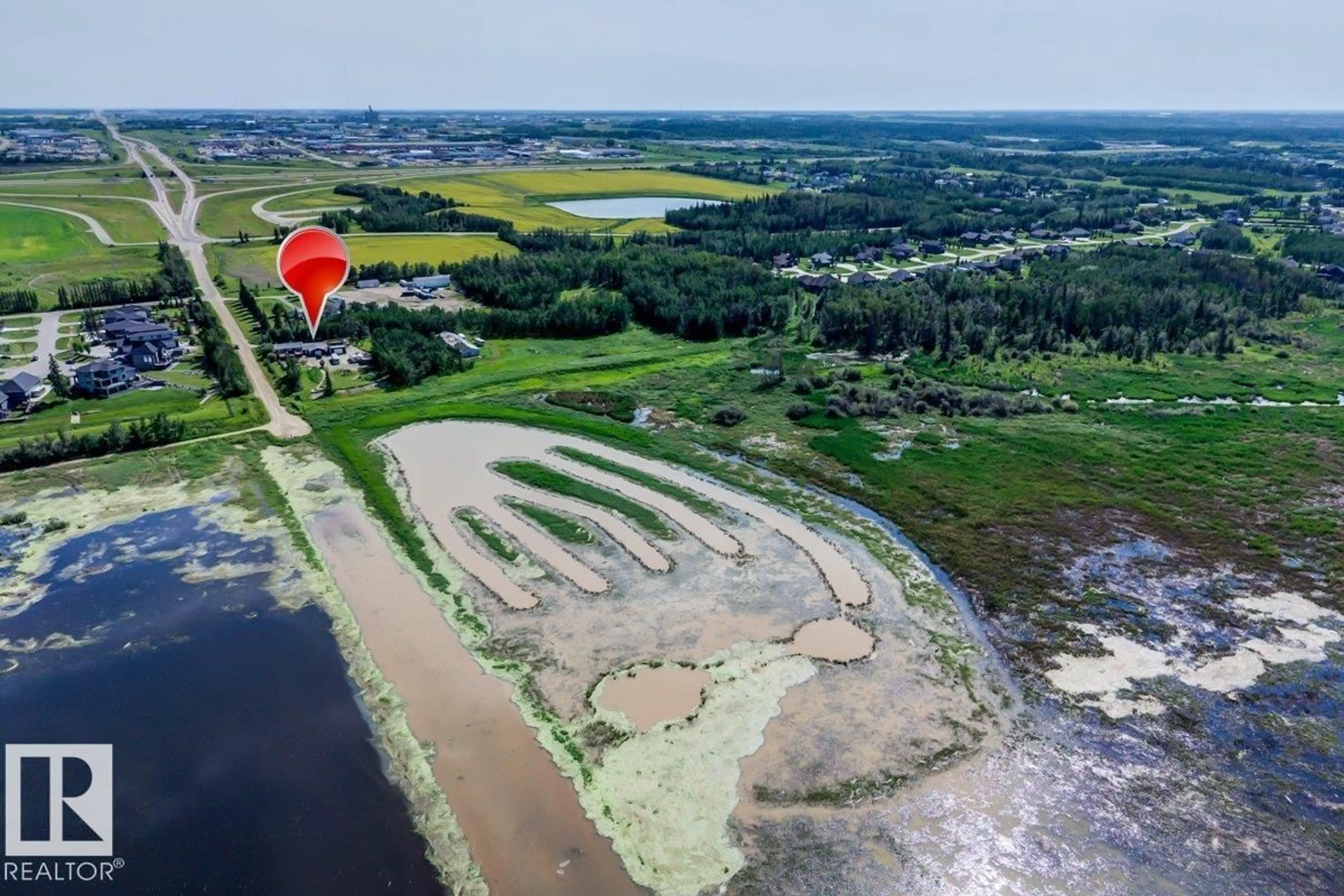 A pic from outside/outdoor area/front of a property/back of a property/a pic from drone, water/lake/river/ocean view for #2 - 53220 RGE ROAD 263, Rural Parkland County Alberta T7X4M1