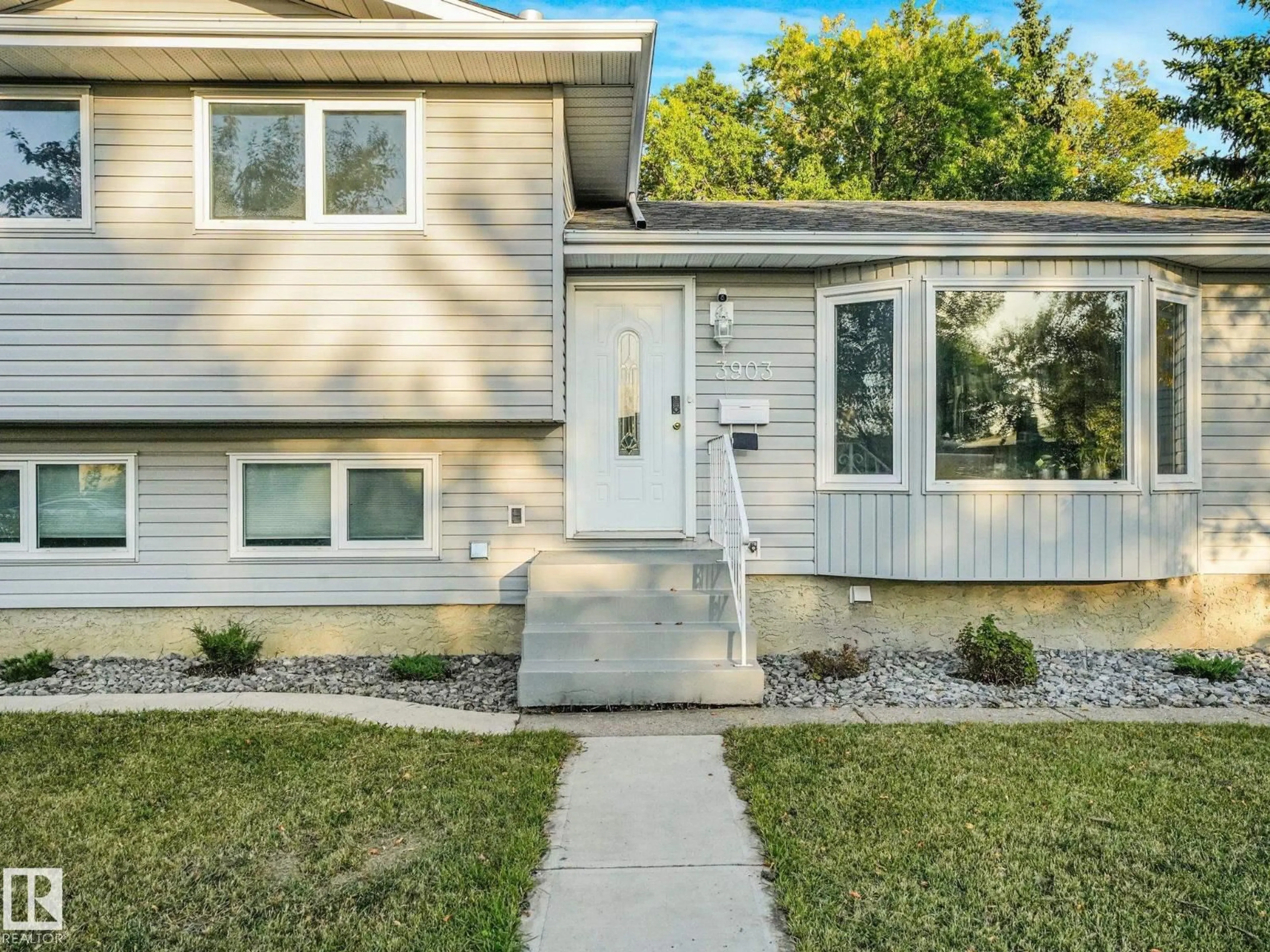 Home with vinyl exterior material, street for 3903 62 ST, Edmonton Alberta T6L1A4