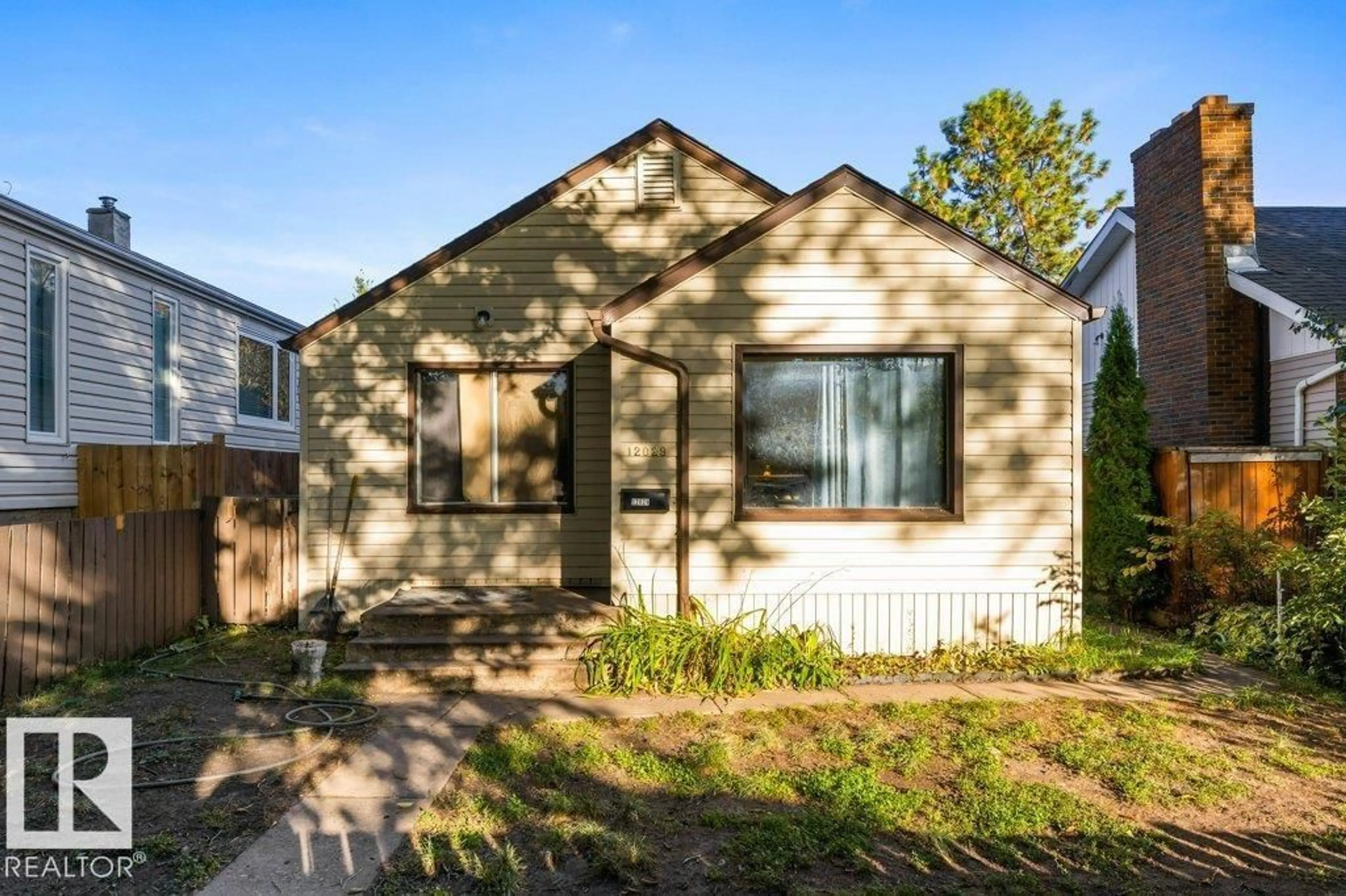 Home with vinyl exterior material, street for NW - 12029 62 ST, Edmonton Alberta T5W4C9