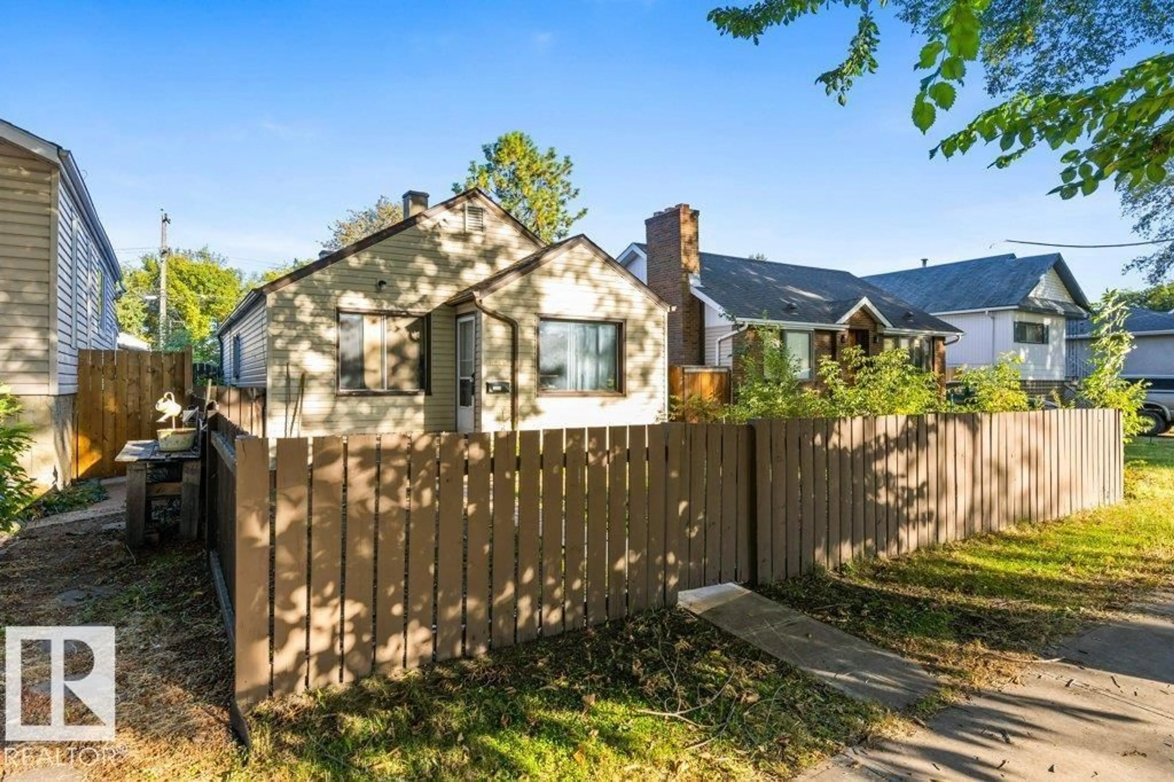 Home with vinyl exterior material, street for NW - 12029 62 ST, Edmonton Alberta T5W4C9