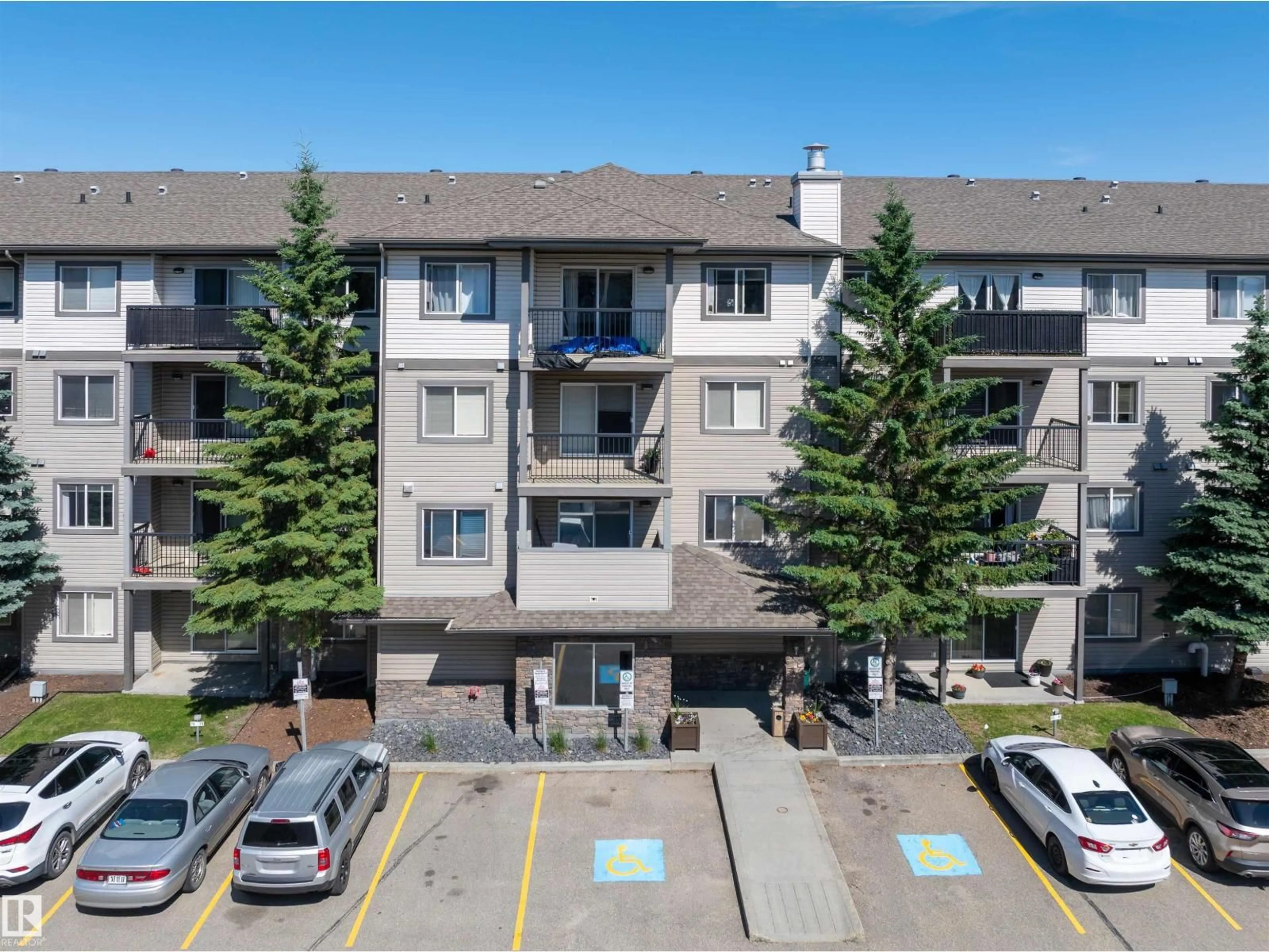 A pic from outside/outdoor area/front of a property/back of a property/a pic from drone, mountain view for 1188 - 214 HYNDMAN RD, Edmonton Alberta T5A0E9