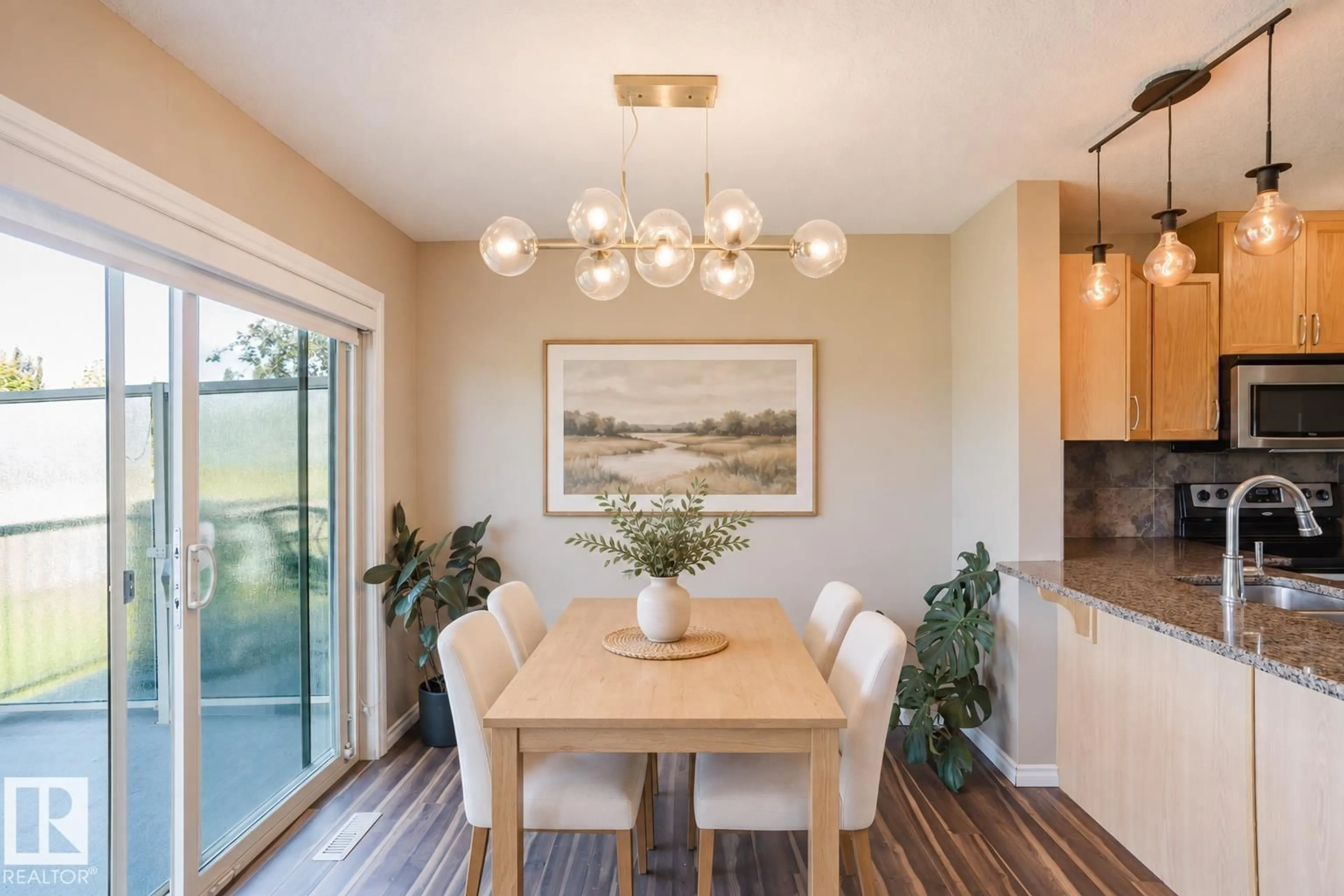 Dining room, wood/laminate floor for 5420 - 106 GRANT MACEWAN BV, Leduc Alberta T9E0M1