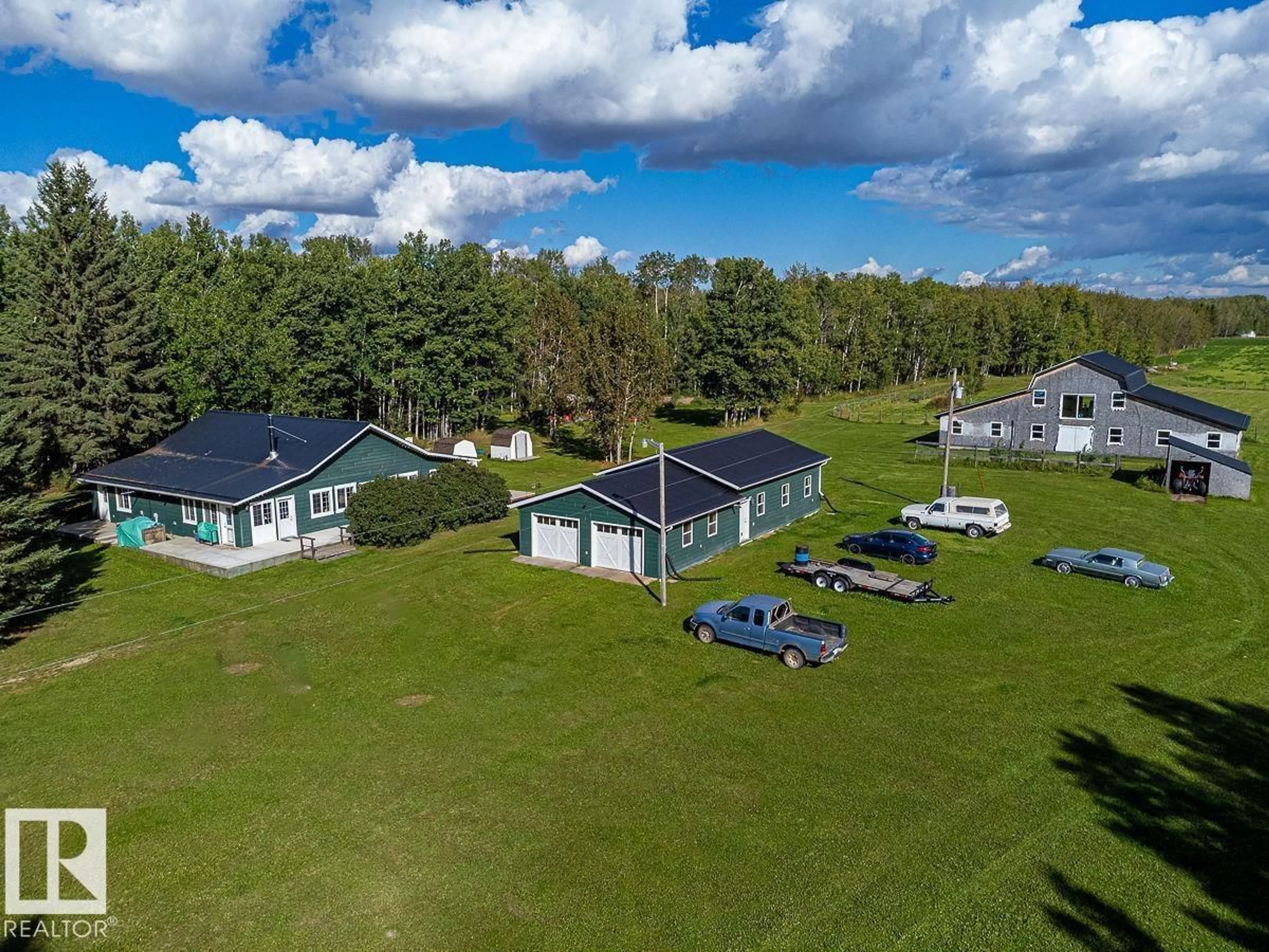 A pic from outside/outdoor area/front of a property/back of a property/a pic from drone, water/lake/river/ocean view for 48177 RGE RD 274, Rural Leduc County Alberta T0C0V0