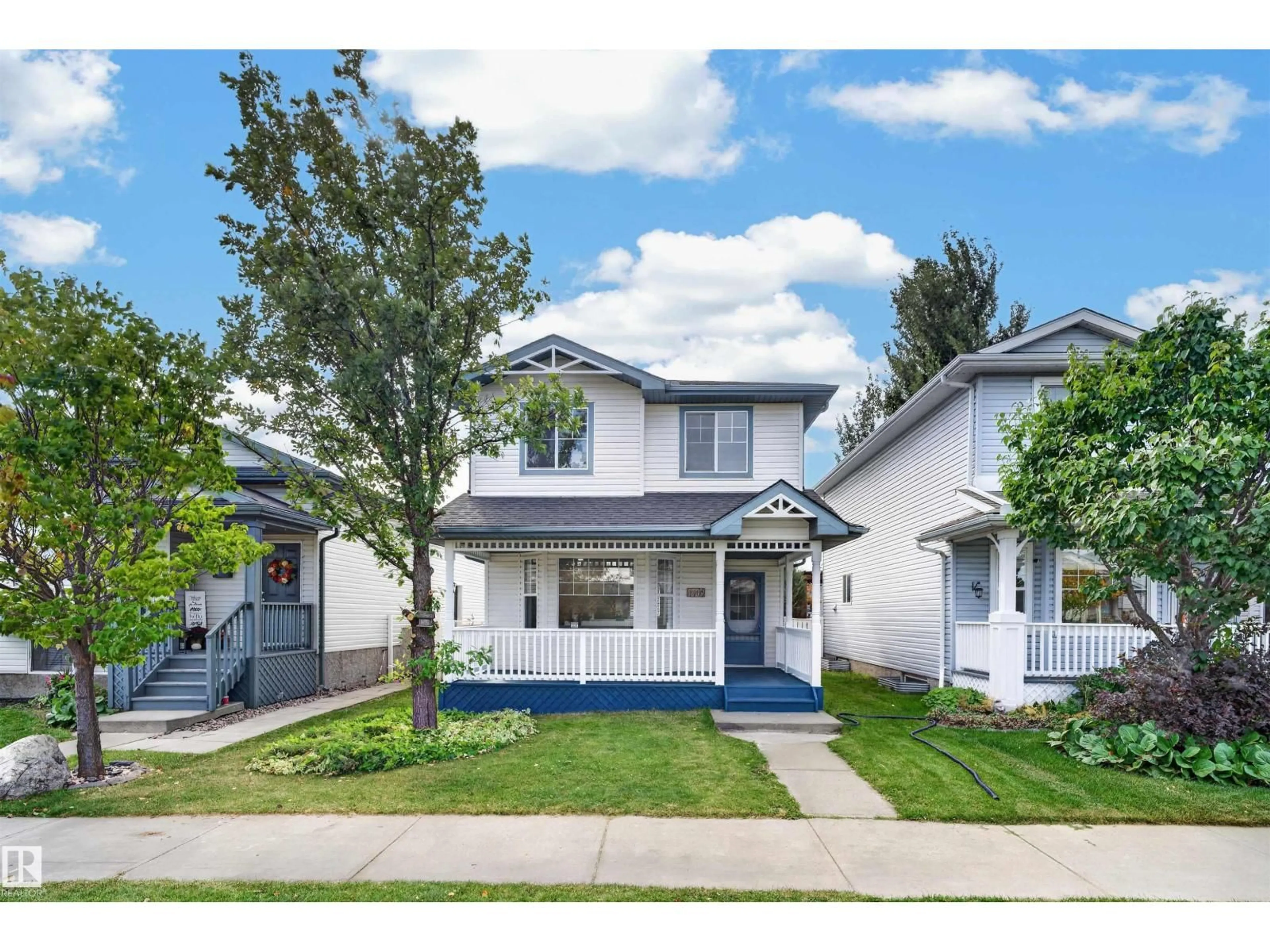 Home with vinyl exterior material, street for NW - 4409 150 AV, Edmonton Alberta T5Y2Z8