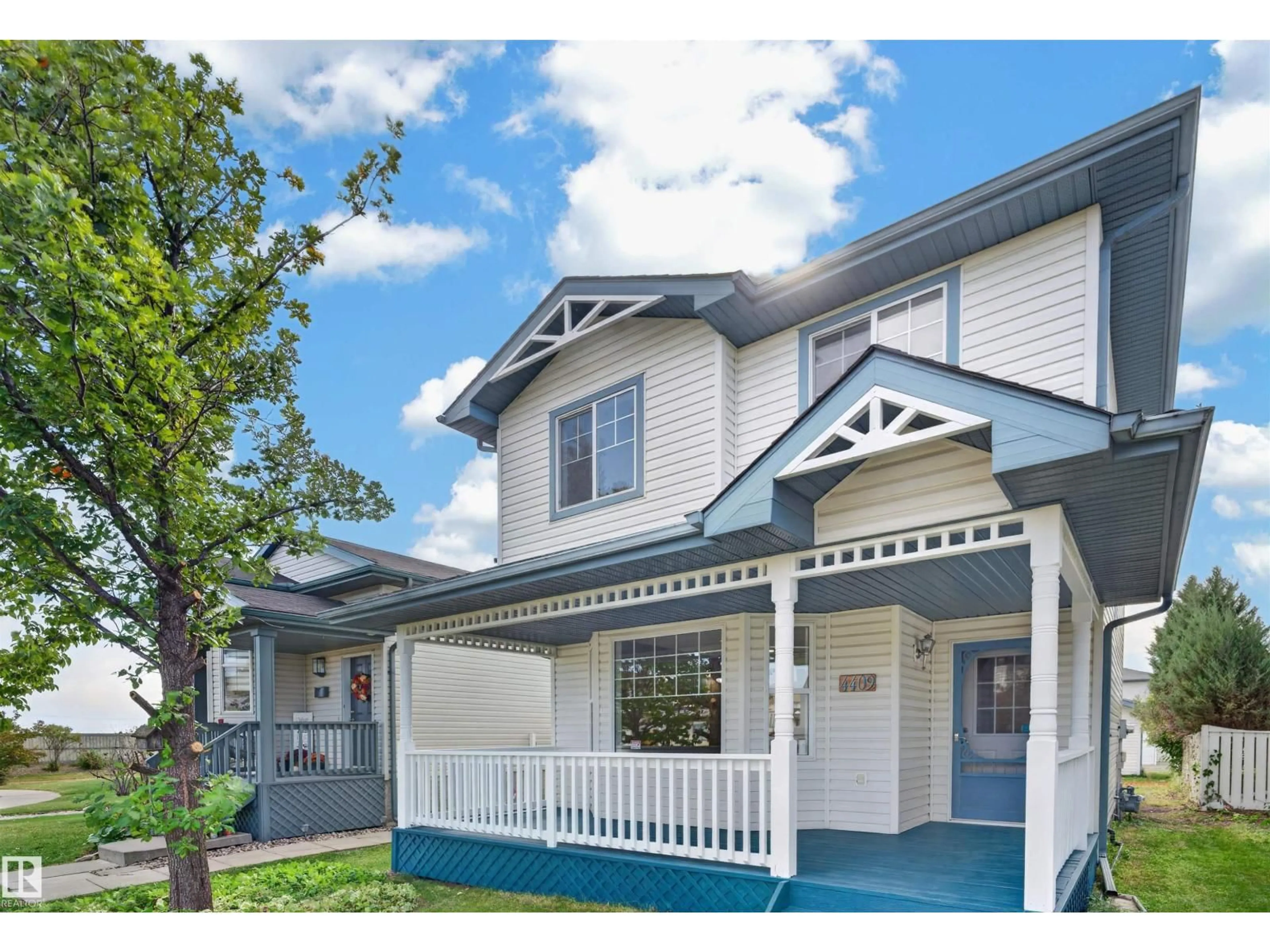 Home with vinyl exterior material, street for NW - 4409 150 AV, Edmonton Alberta T5Y2Z8