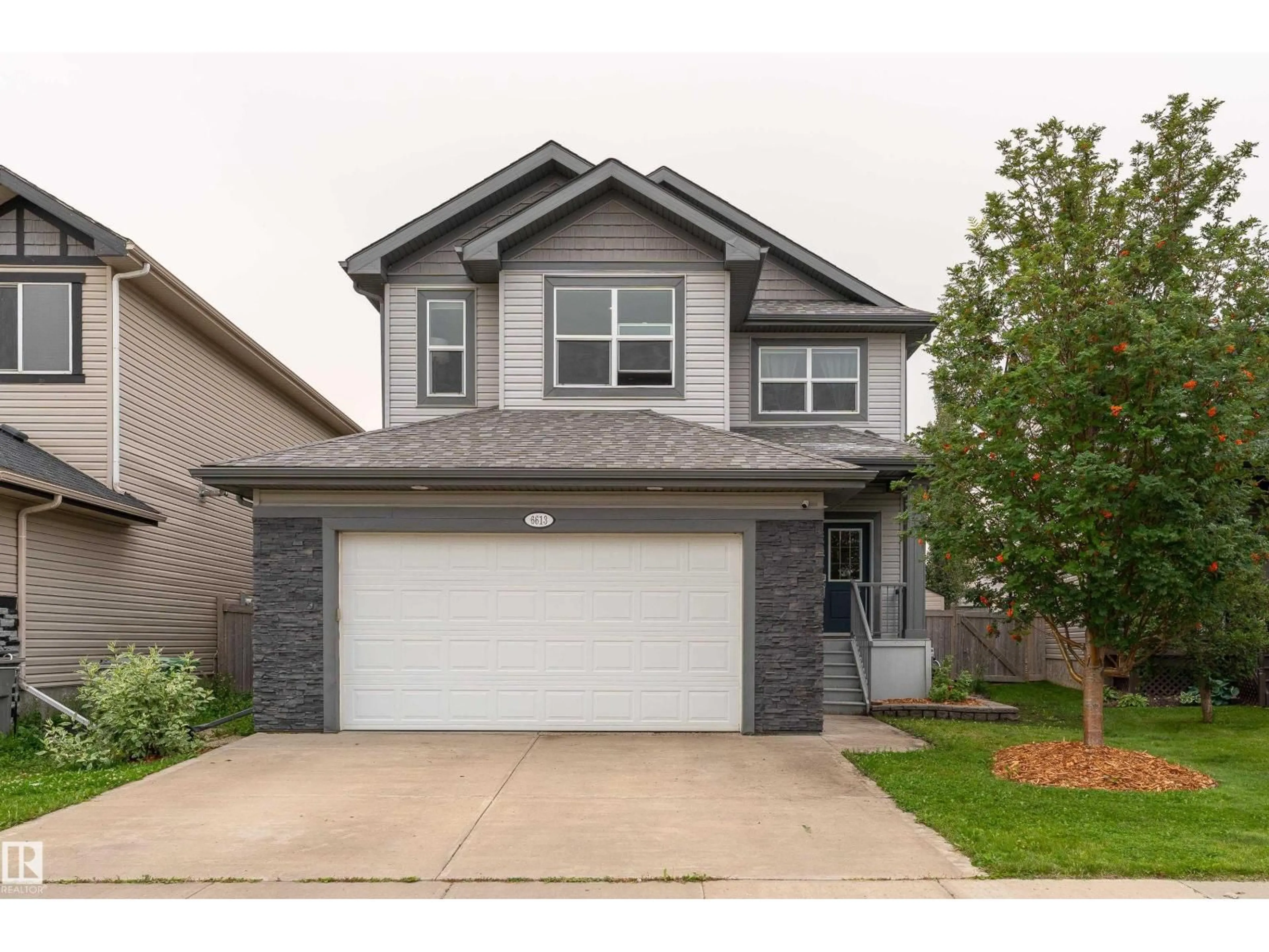 Home with vinyl exterior material, street for 6613 31 AV, Beaumont Alberta T4X0W7