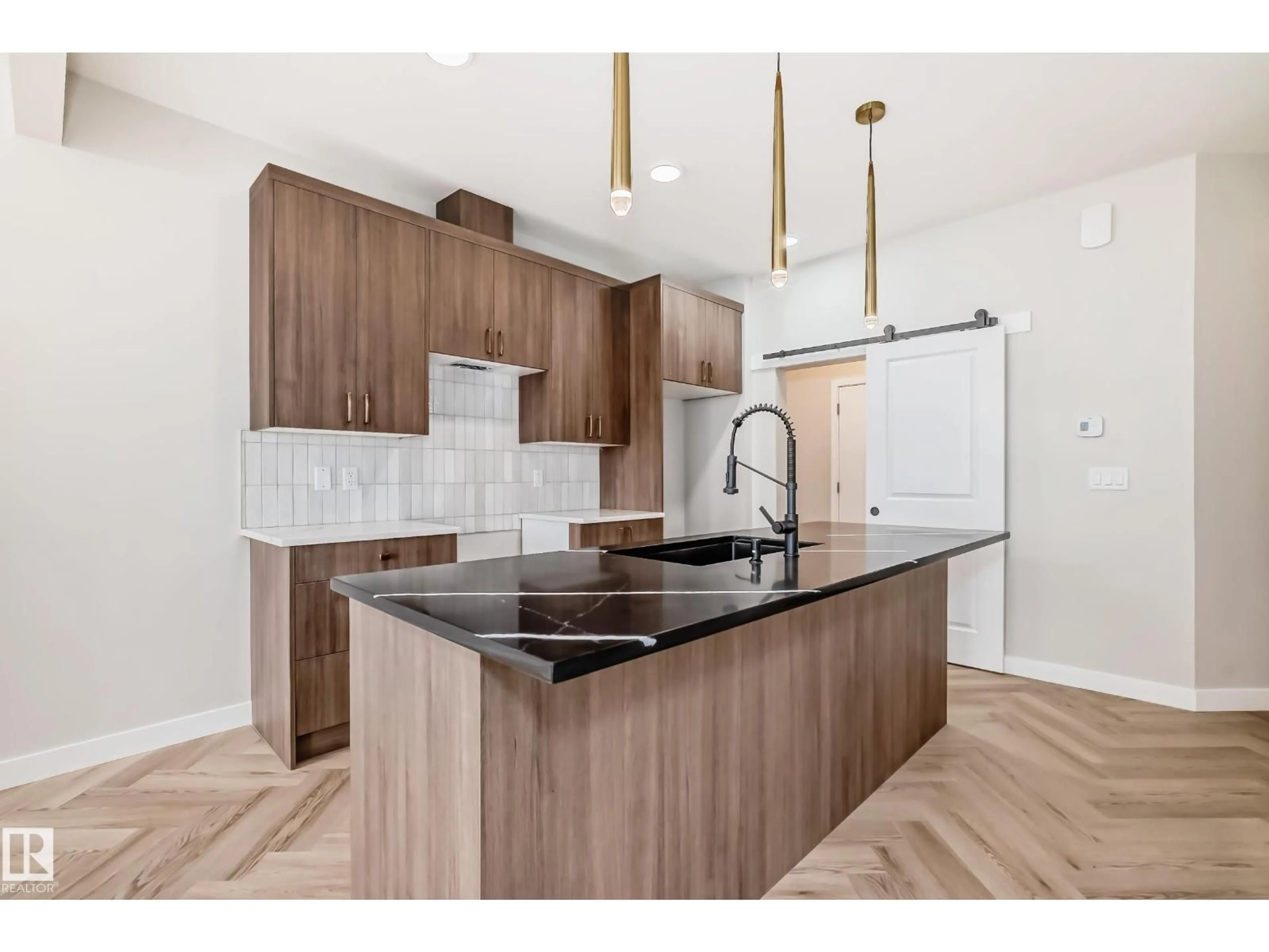 Open concept kitchen, wood/laminate floor for 2617 62 ST, Edmonton Alberta T6X3G3