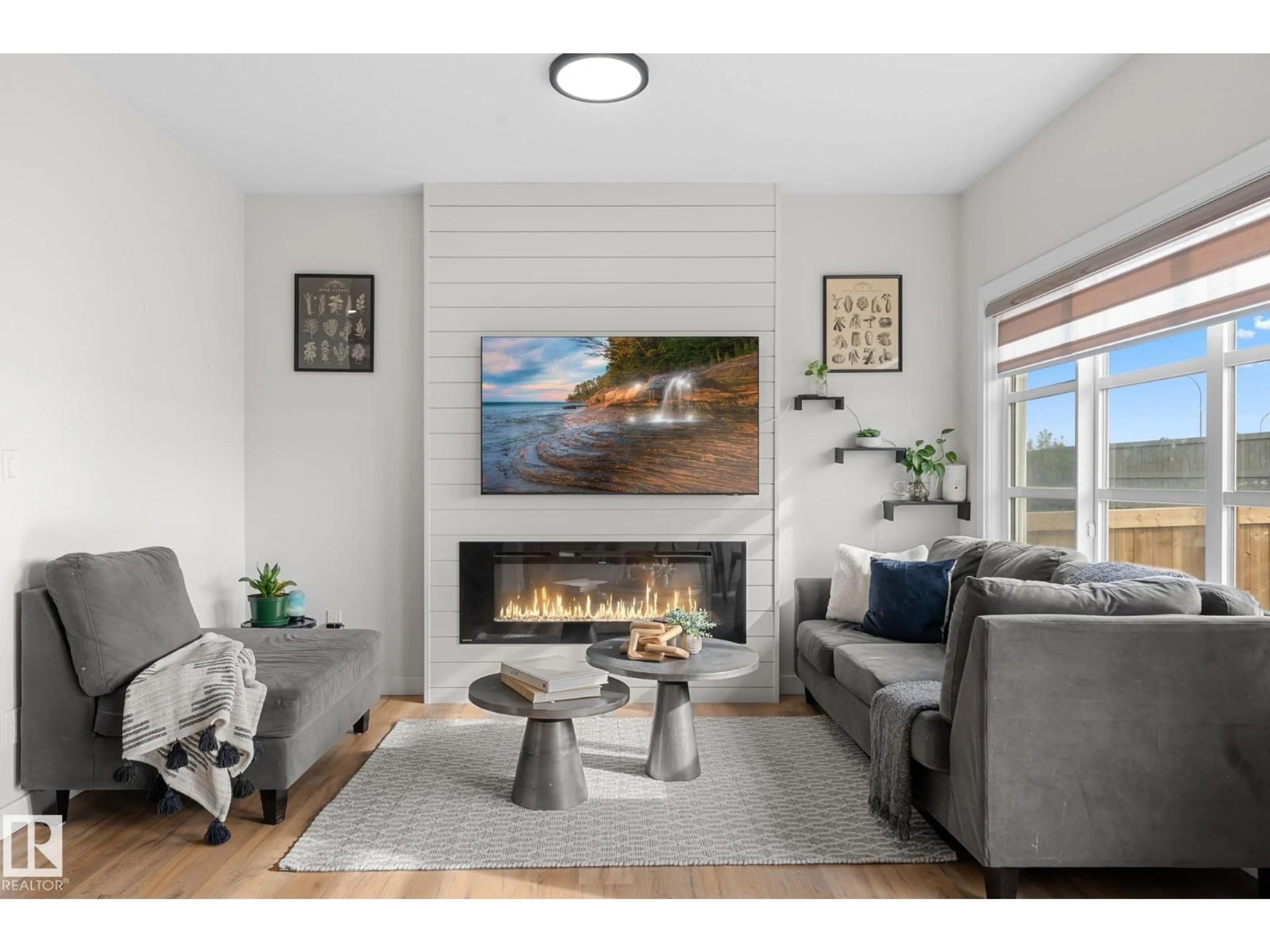 Living room with furniture, wood/laminate floor for NW - 1142 GOLDFINCH CR, Edmonton Alberta T5S0R1