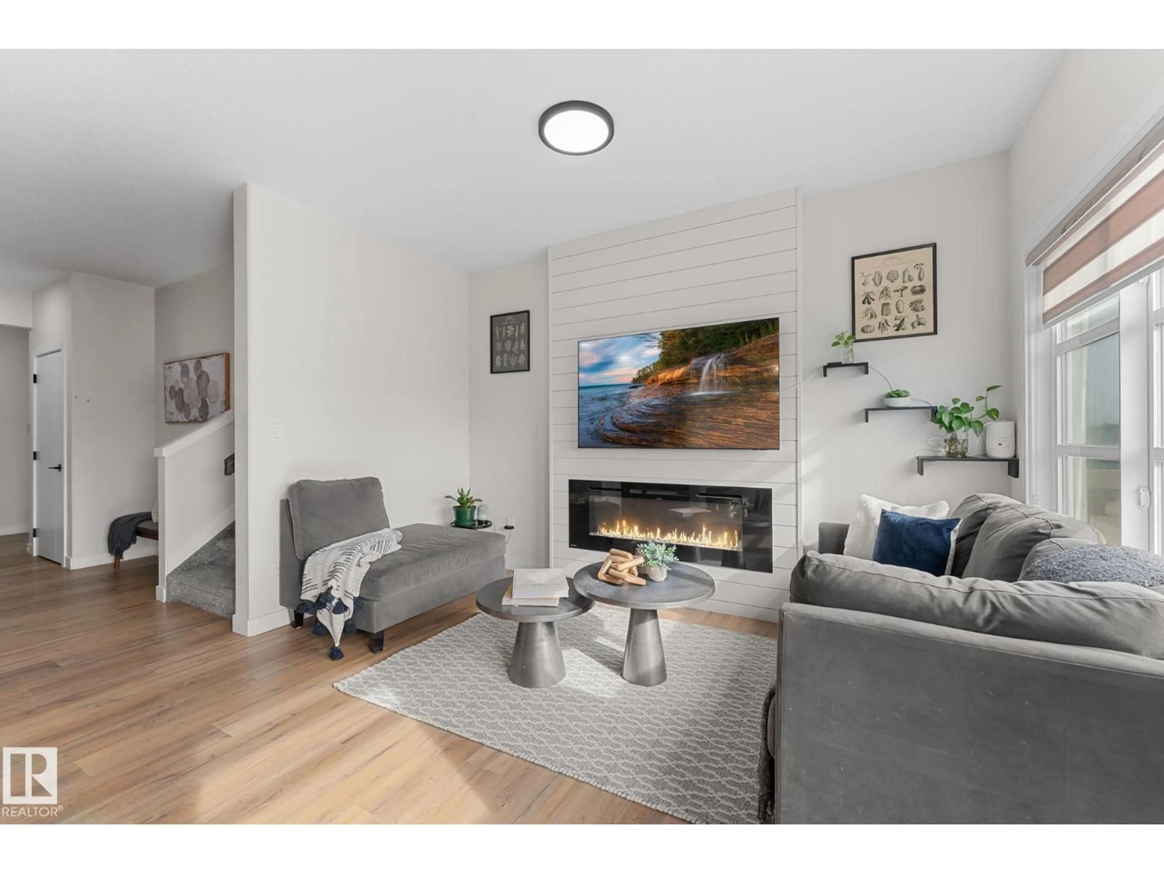 Living room with furniture, wood/laminate floor for NW - 1142 GOLDFINCH CR, Edmonton Alberta T5S0R1