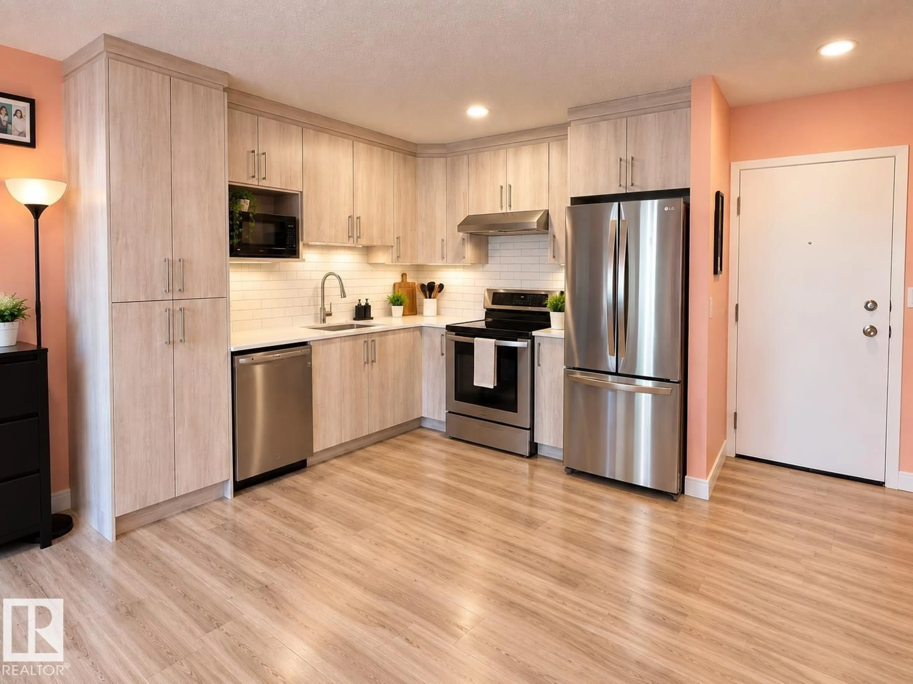 Open concept kitchen, wood/laminate floor for #108 - 2624 MILL WOODS RD E, Edmonton Alberta T6L5K7