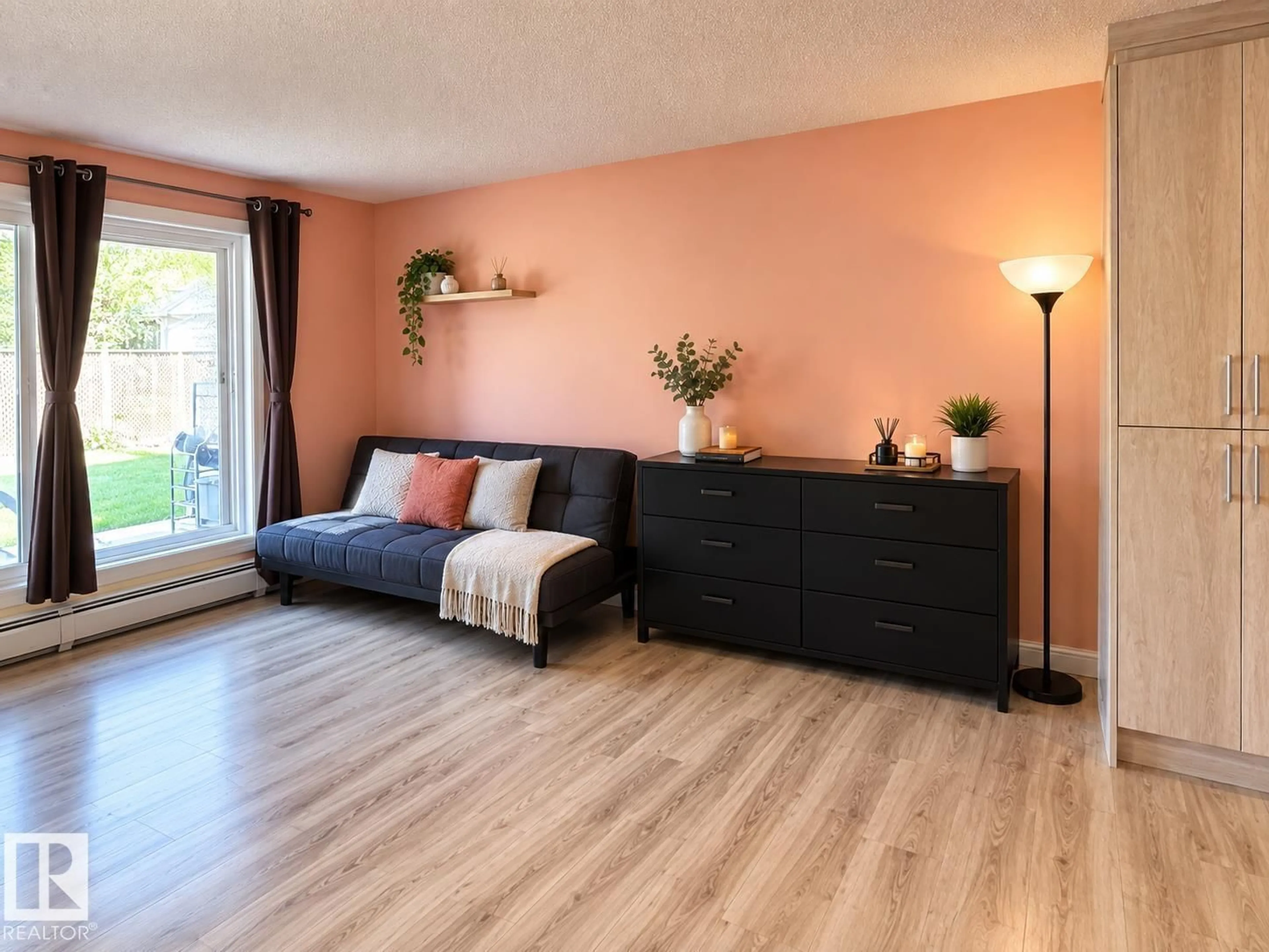 Living room with furniture, wood/laminate floor for #108 - 2624 MILL WOODS RD E, Edmonton Alberta T6L5K7
