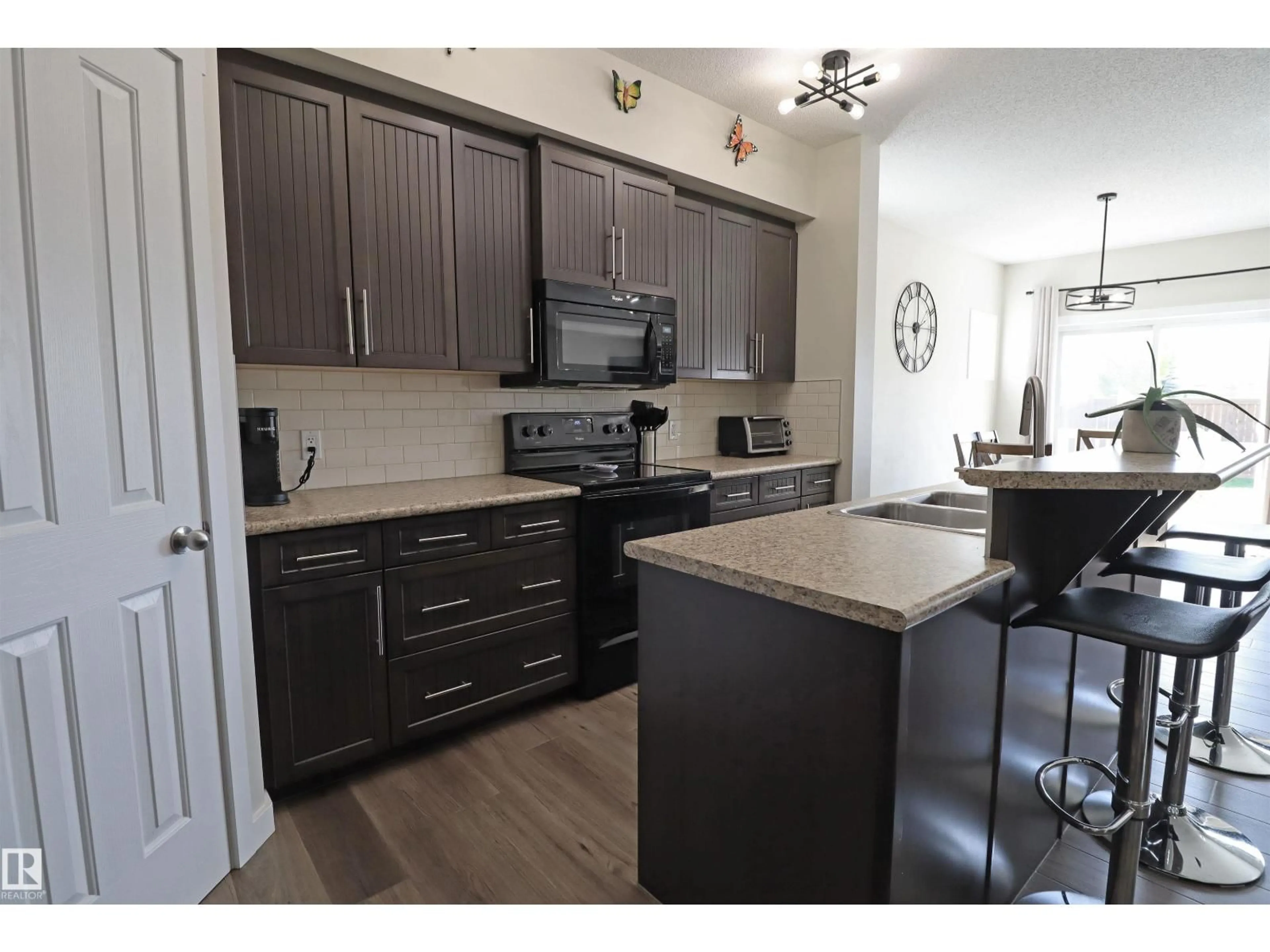 Open concept kitchen, wood/laminate floor for 44 HARTWICK MR, Spruce Grove Alberta T7X0L8