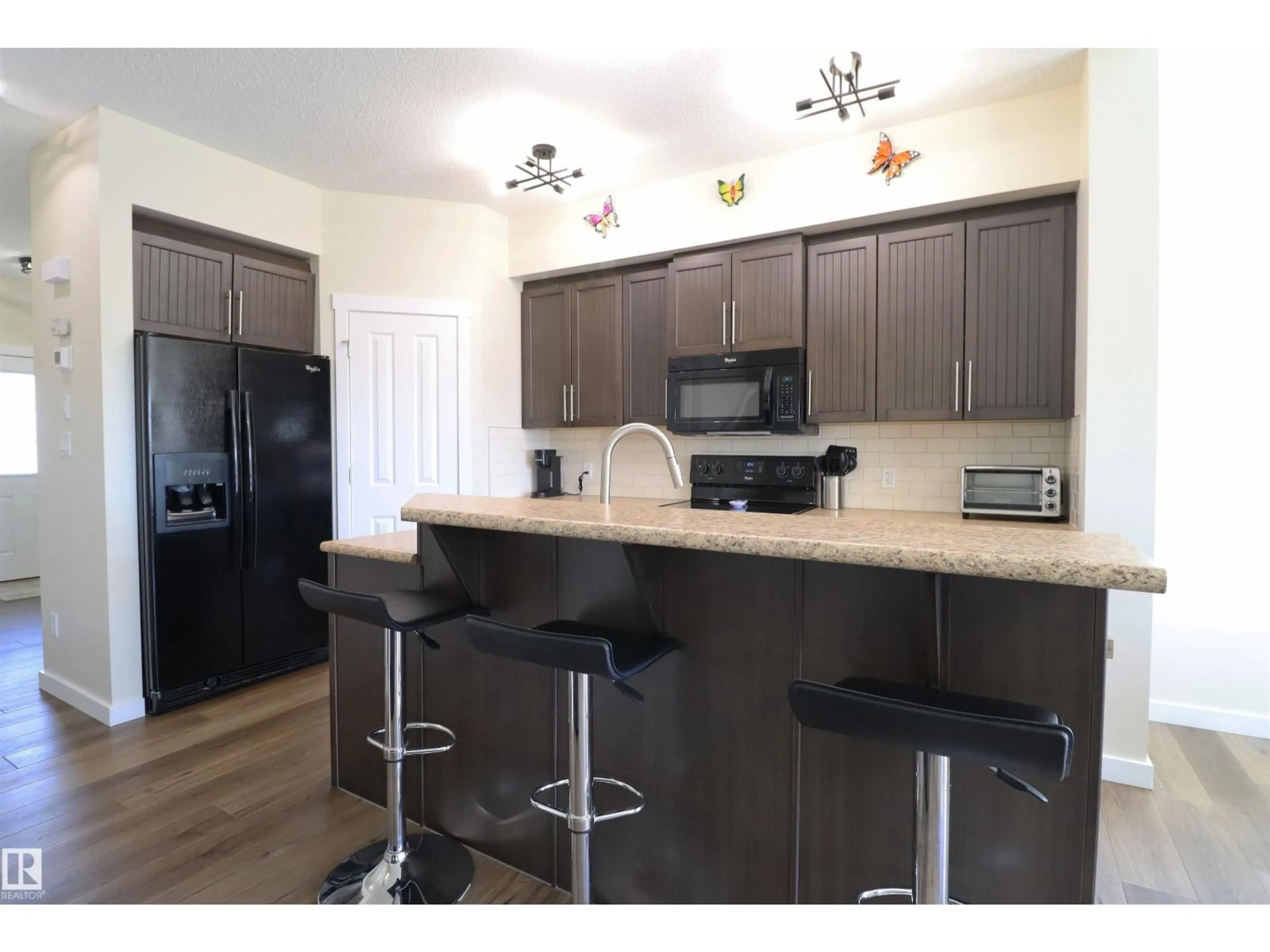 Open concept kitchen, wood/laminate floor for 44 HARTWICK MR, Spruce Grove Alberta T7X0L8
