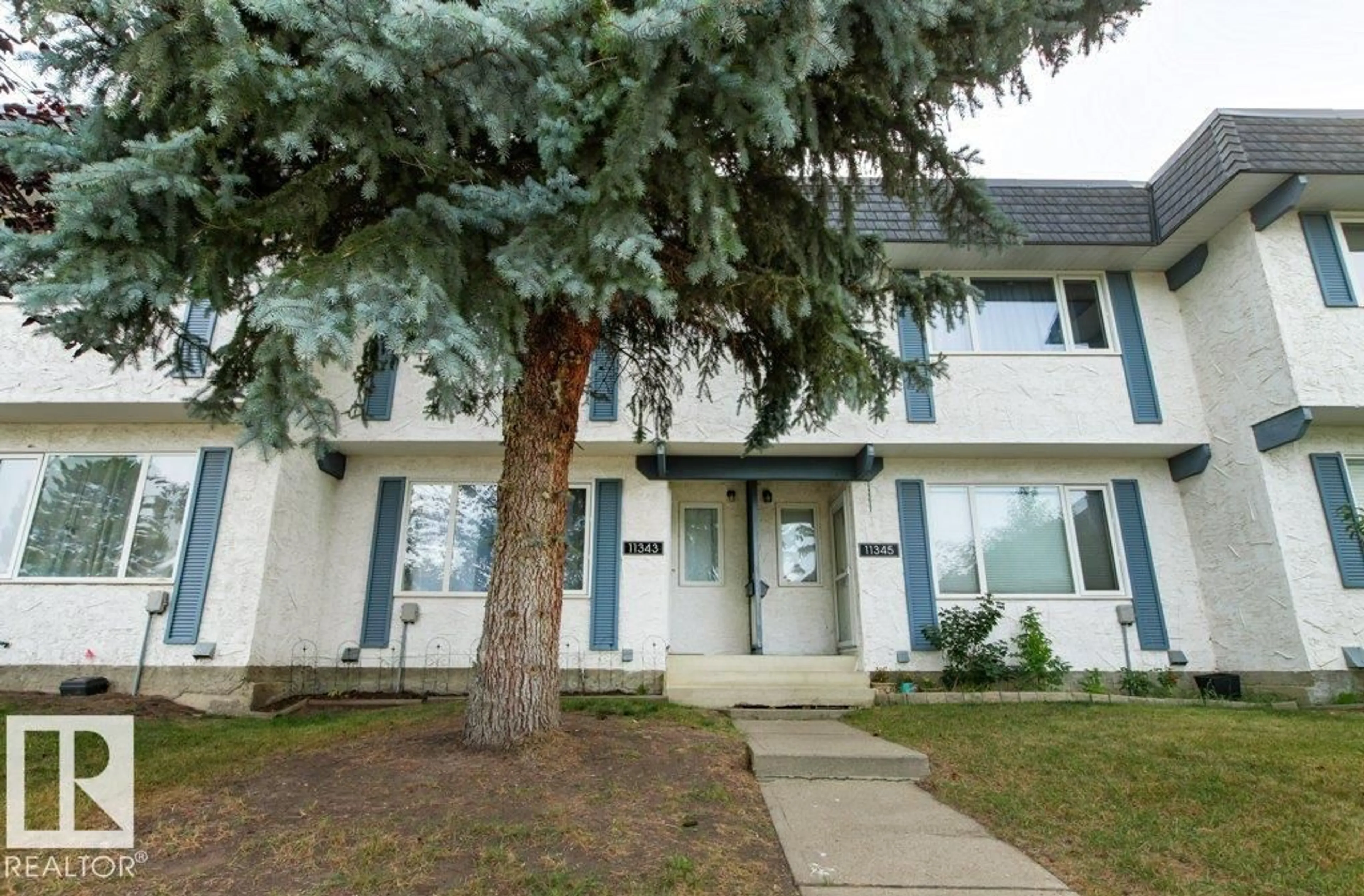 Home with vinyl exterior material, street for 11343 22 AV, Edmonton Alberta T6J4V8
