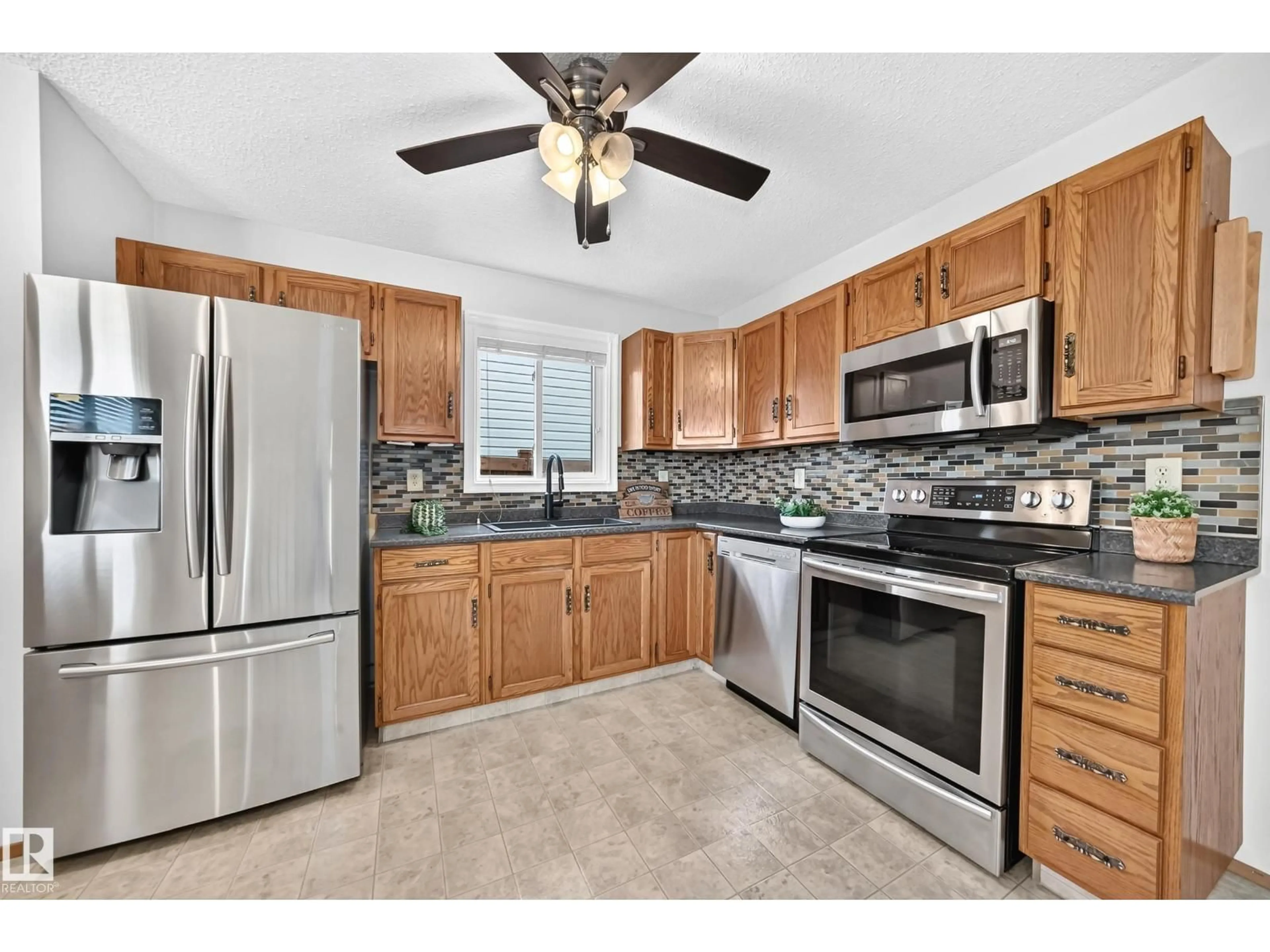 Standard kitchen, ceramic/tile floor for 14519 32 ST, Edmonton Alberta T5Y2L2