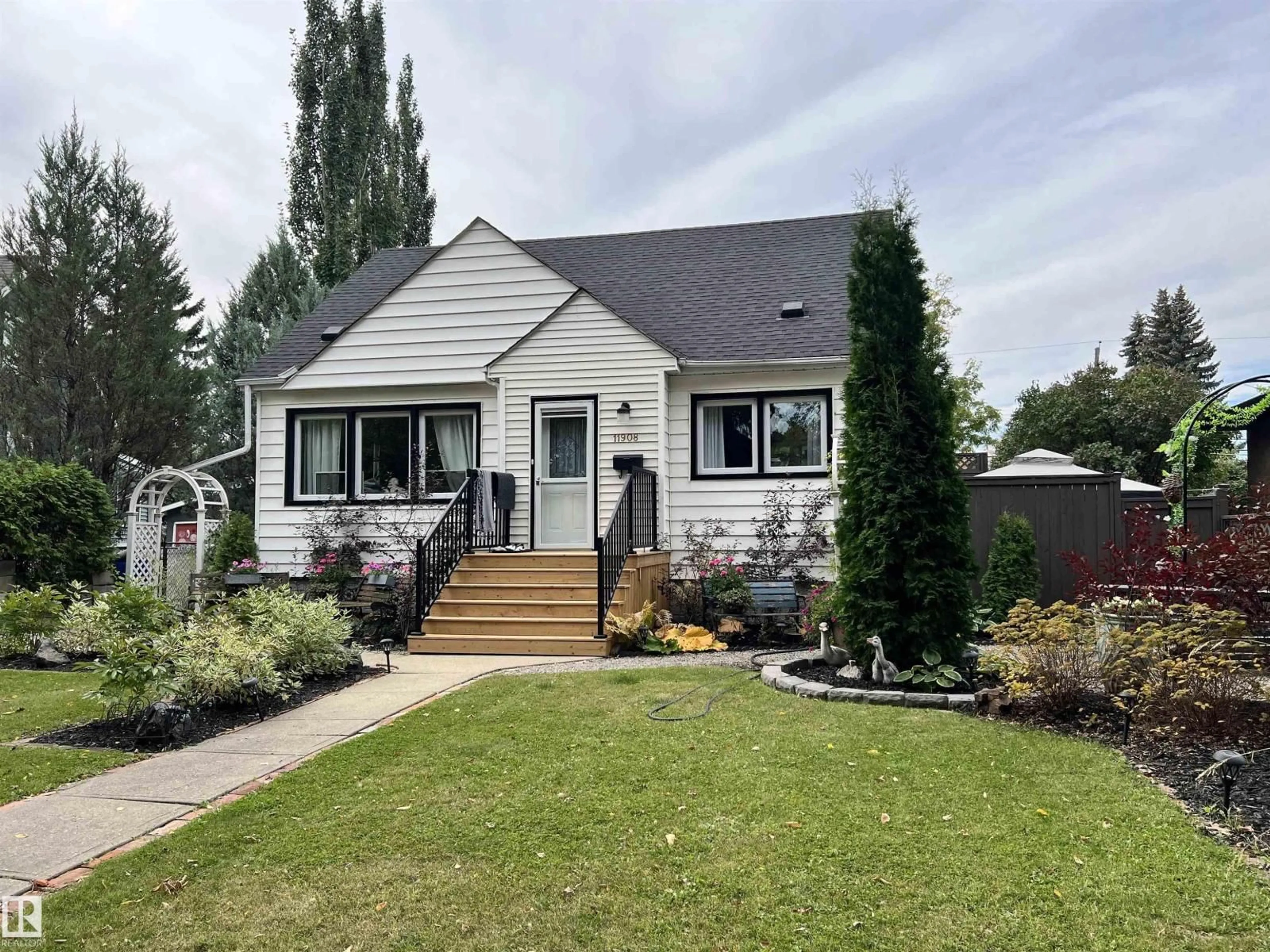 Home with vinyl exterior material, street for NW - 11908 131 ST, Edmonton Alberta T5L1M4