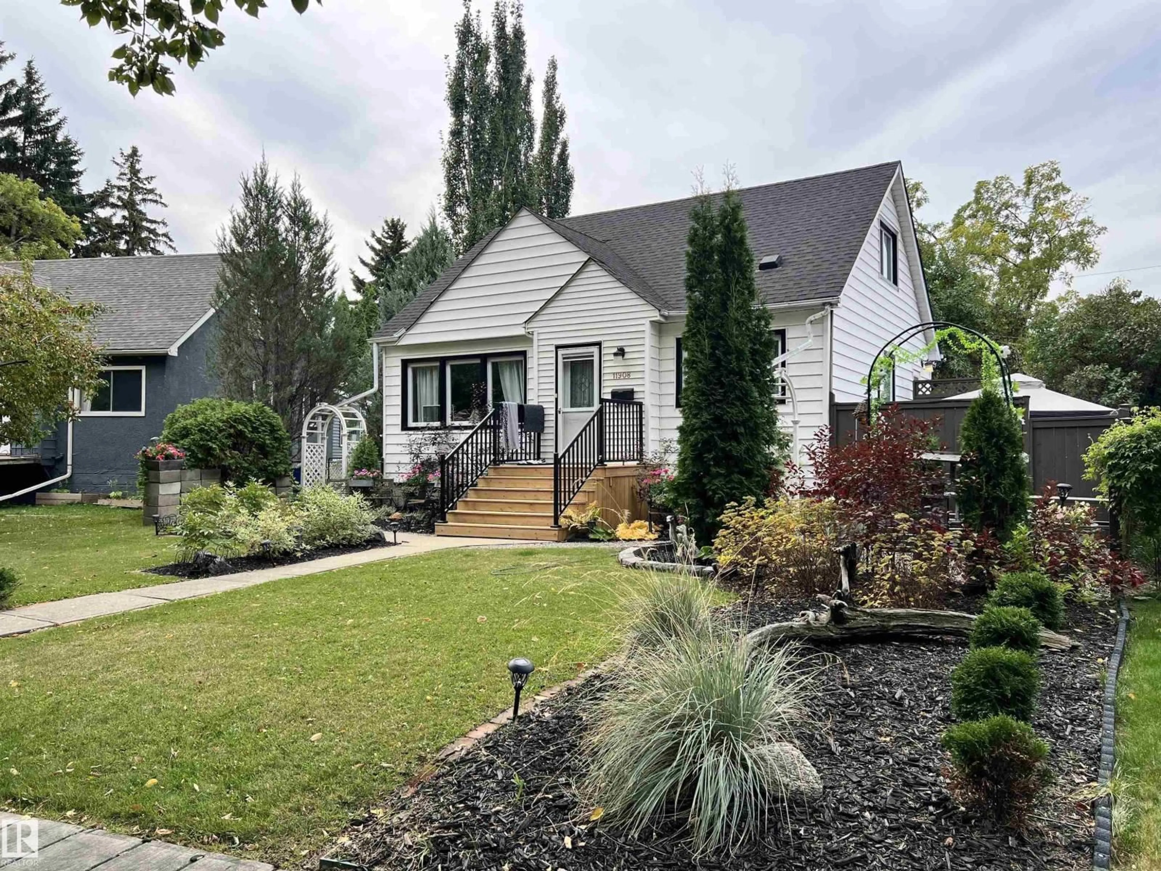 Home with vinyl exterior material, street for NW - 11908 131 ST, Edmonton Alberta T5L1M4