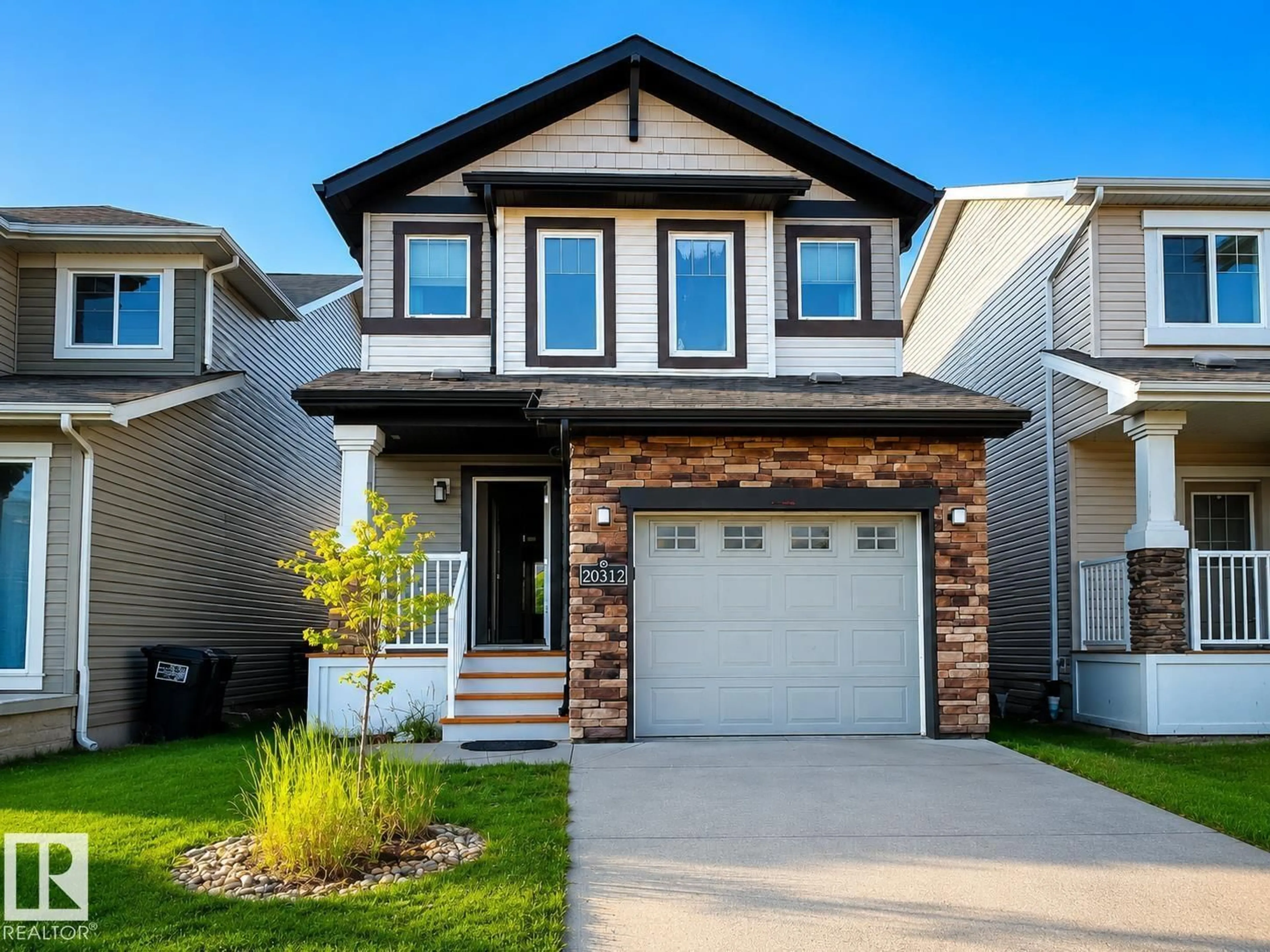 Home with vinyl exterior material, street for NW - 20312 42 AV, Edmonton Alberta T6M0R8