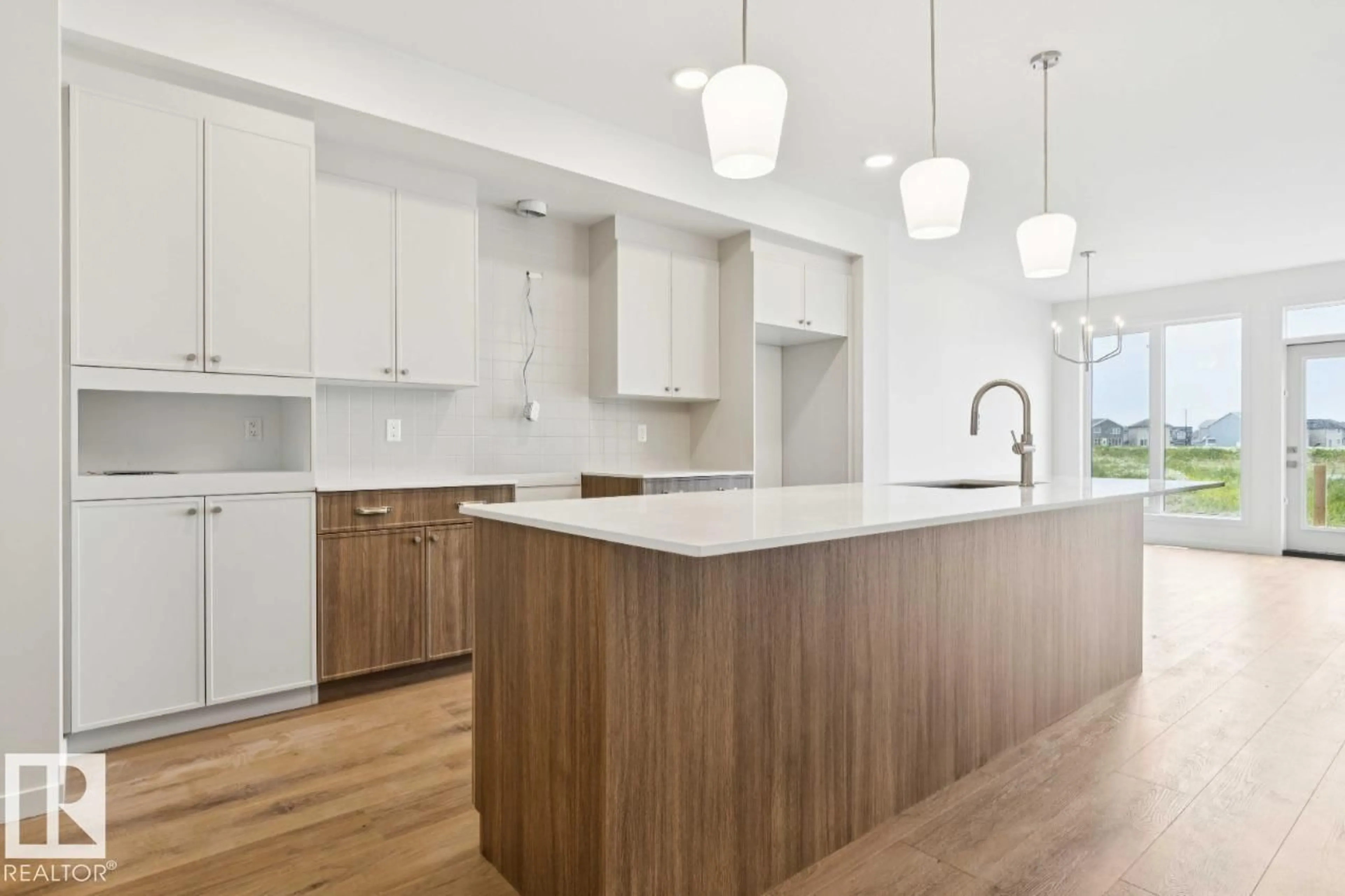 Open concept kitchen, wood/laminate floor for 194 STETSON LO, Ardrossan Alberta T8E2E4