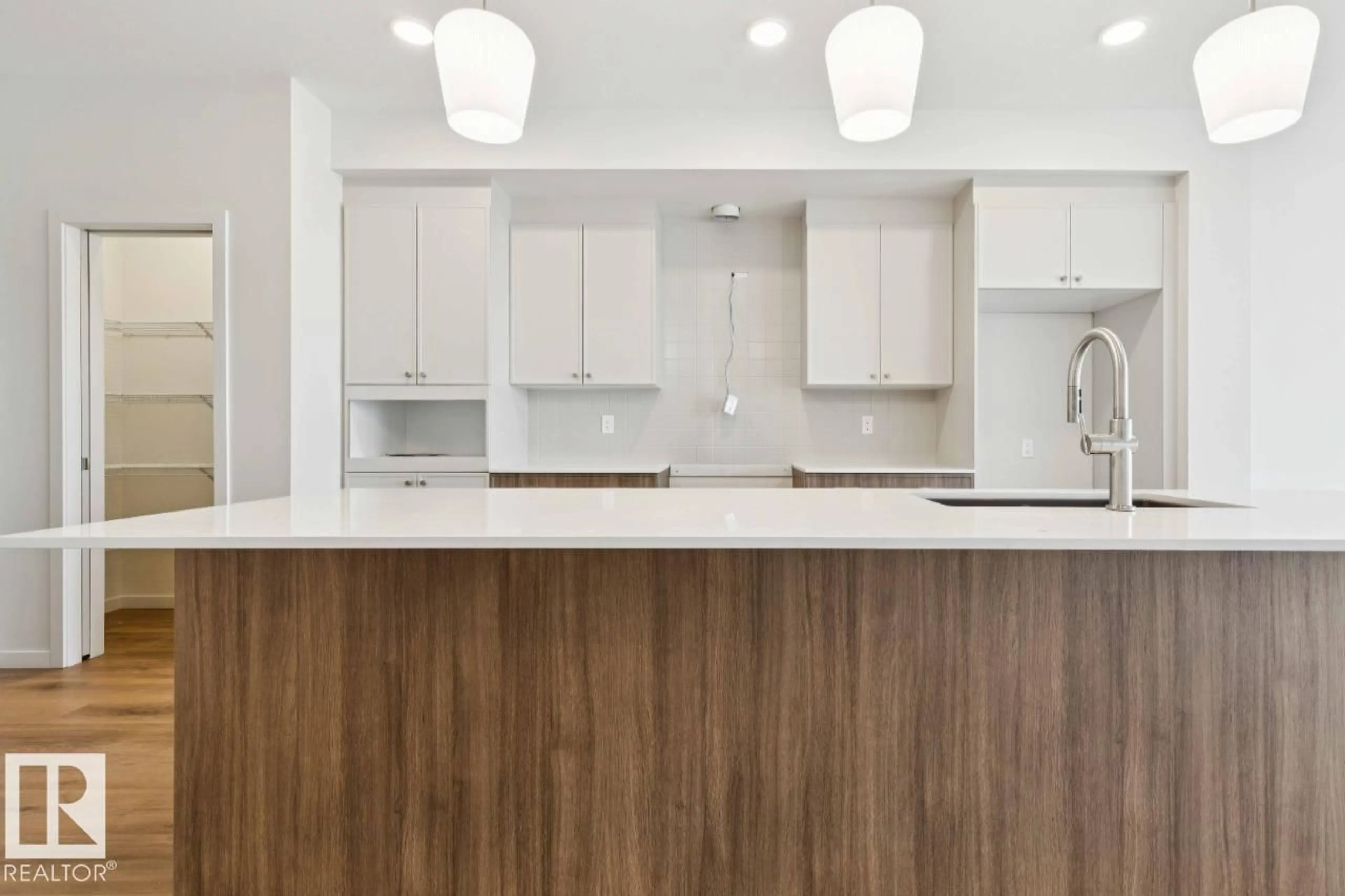 Open concept kitchen, wood/laminate floor for 194 STETSON LO, Ardrossan Alberta T8E2E4