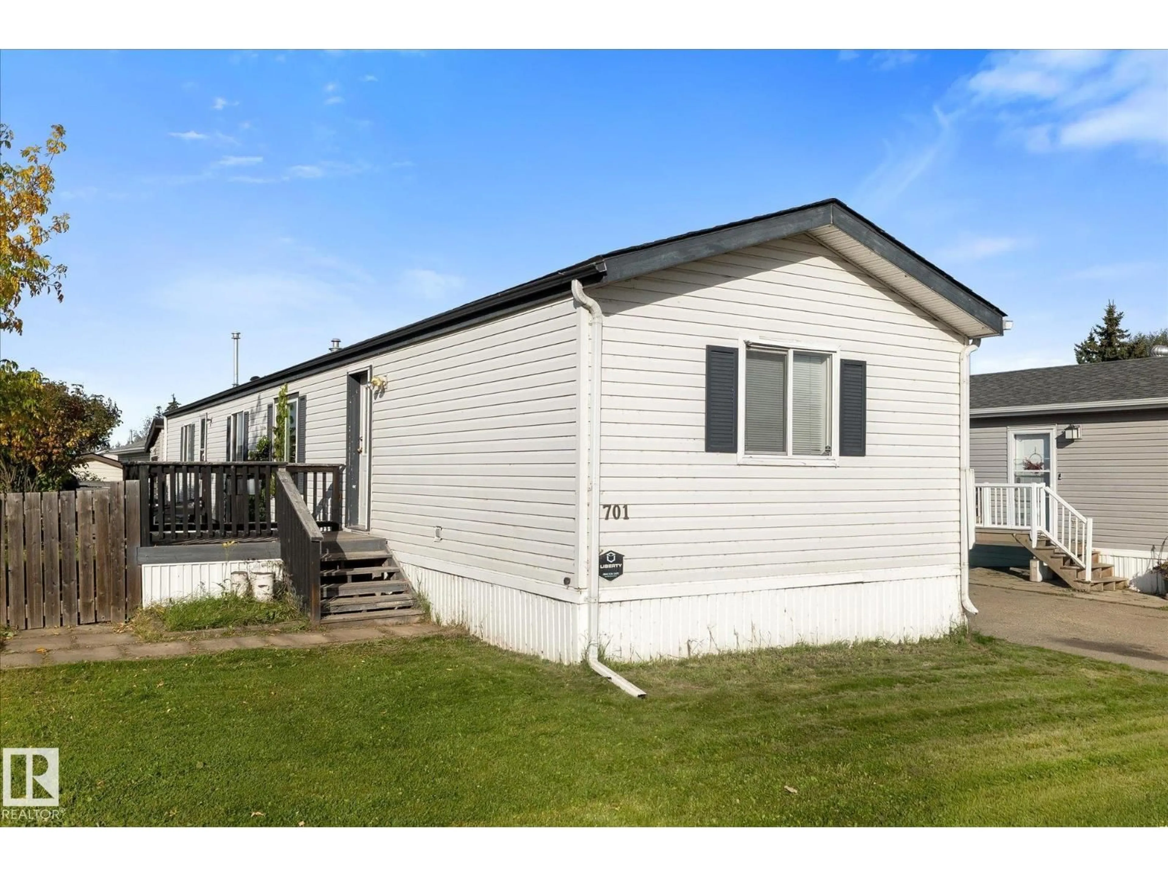 Home with vinyl exterior material, building for 701 53222 RANGE ROAD 272, Rural Parkland County Alberta T7X3P9