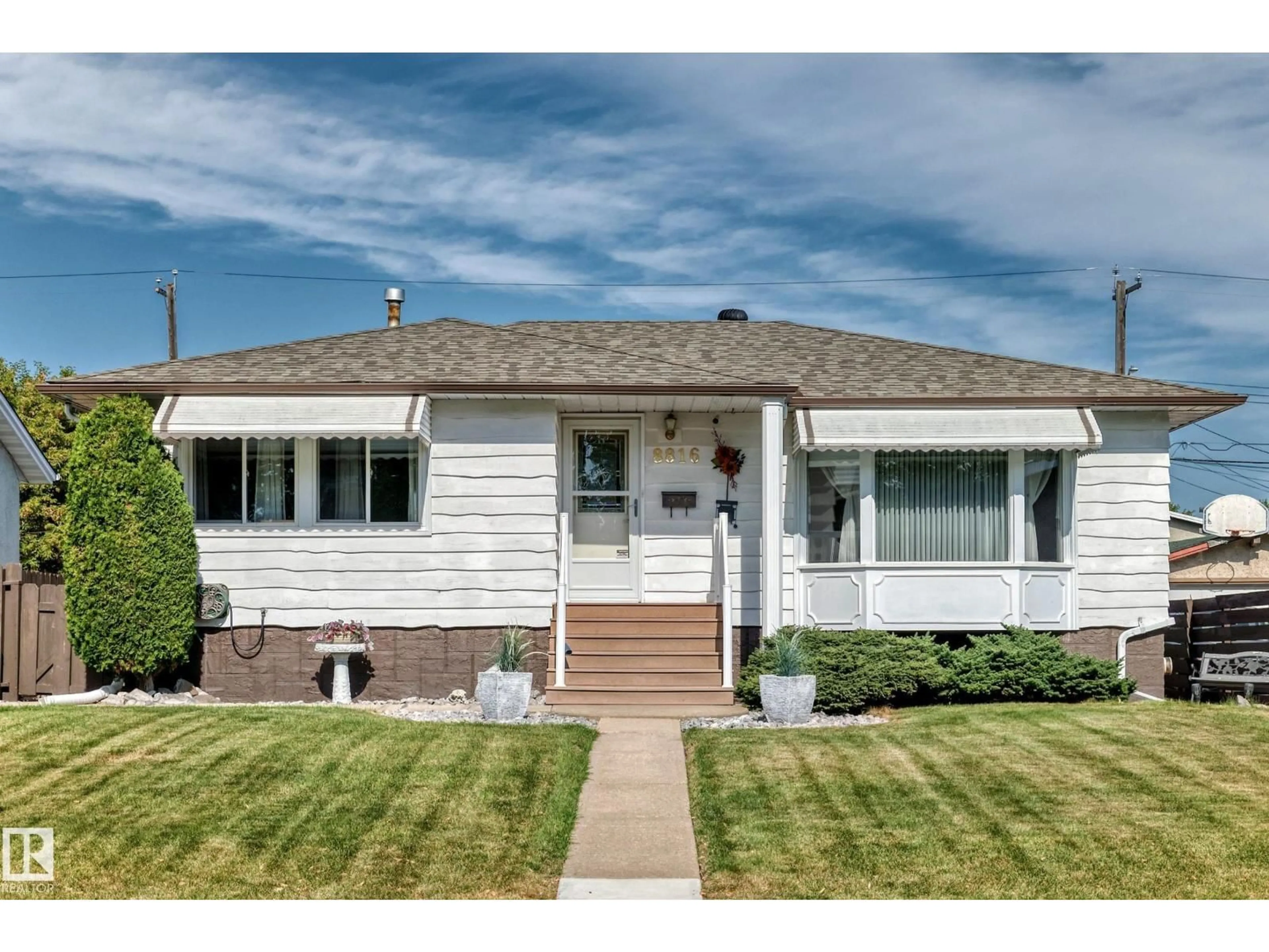 Home with vinyl exterior material, street for 8816 131A AV NW, Edmonton Alberta T5E0X2